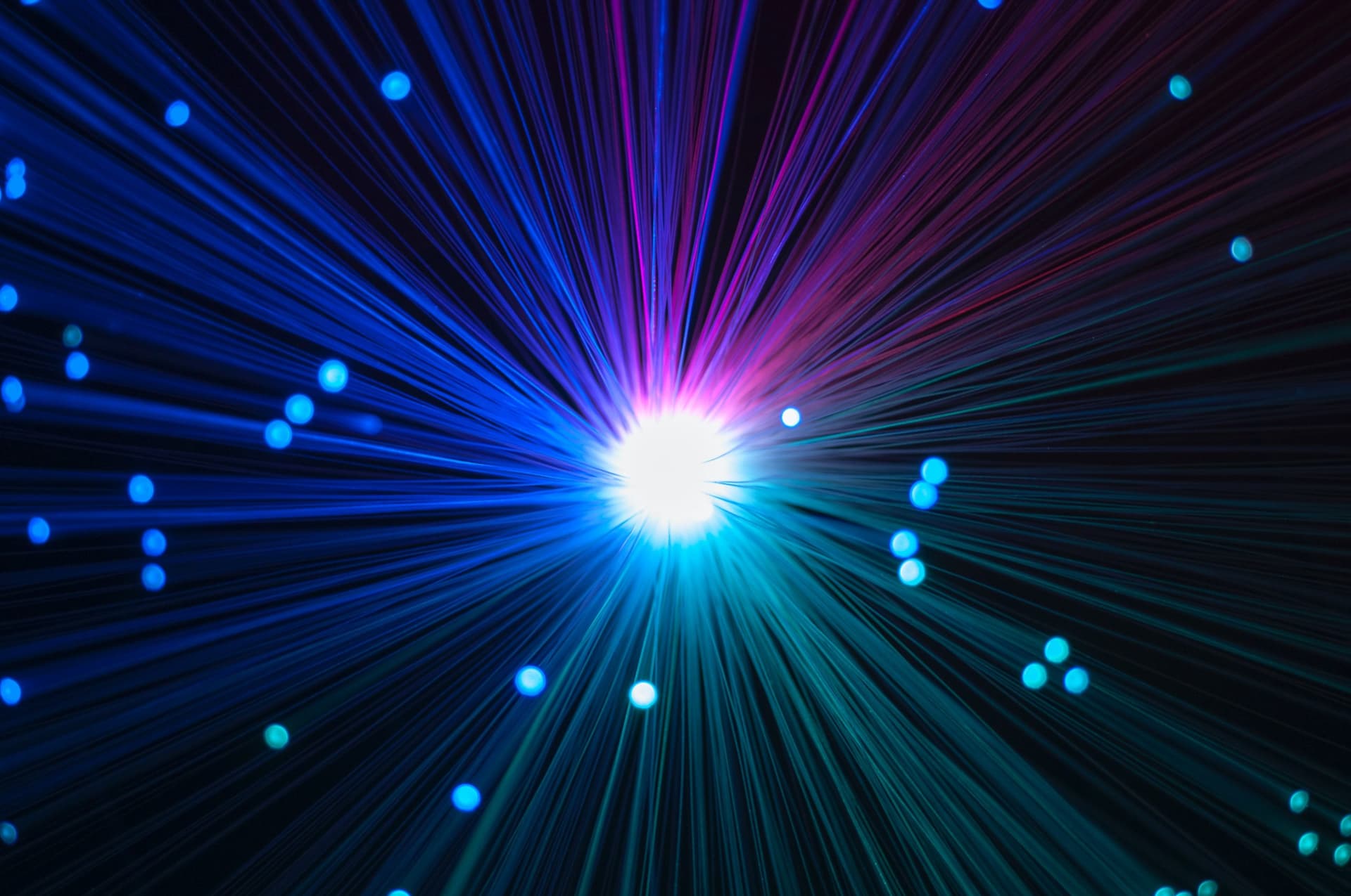 closeup of optical fibers from a colorful lamp