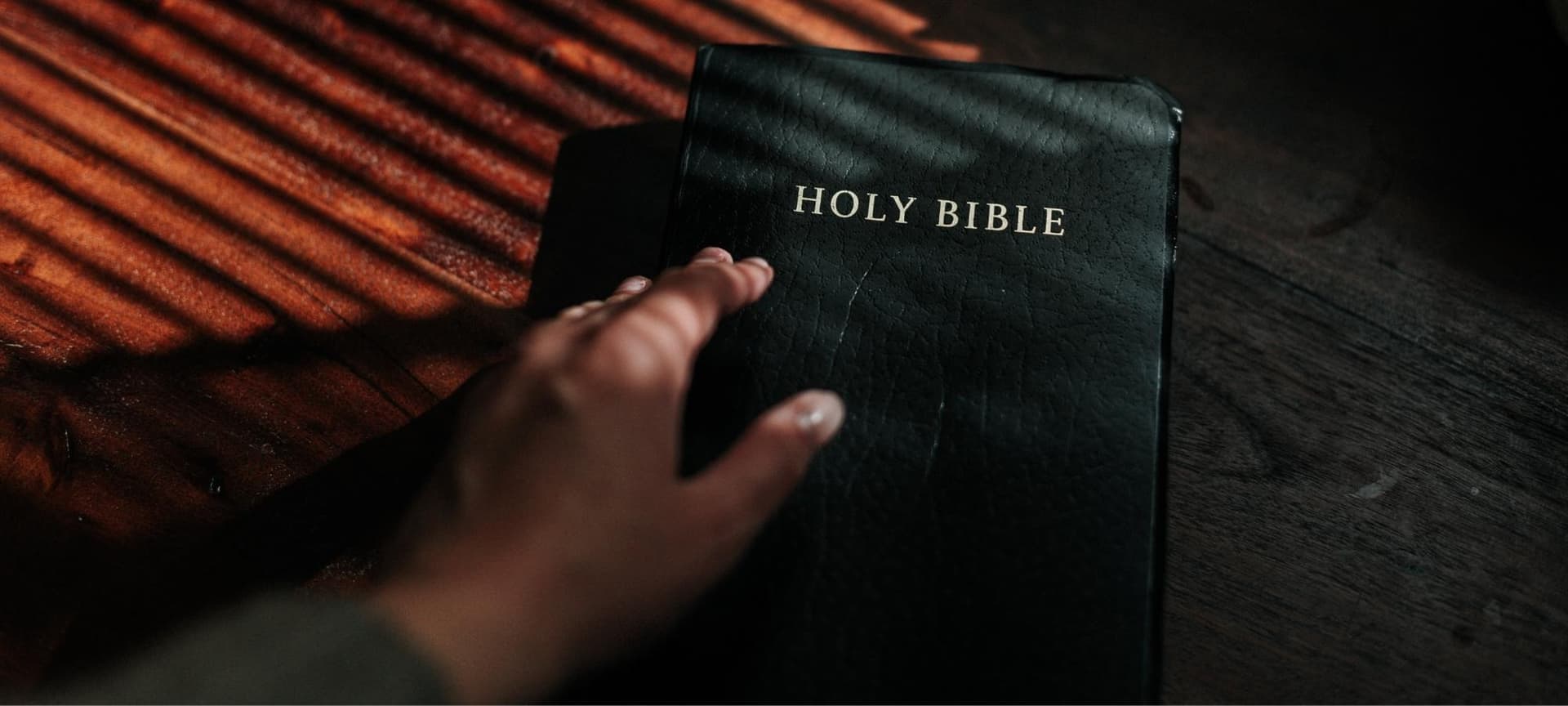 Hand on bible