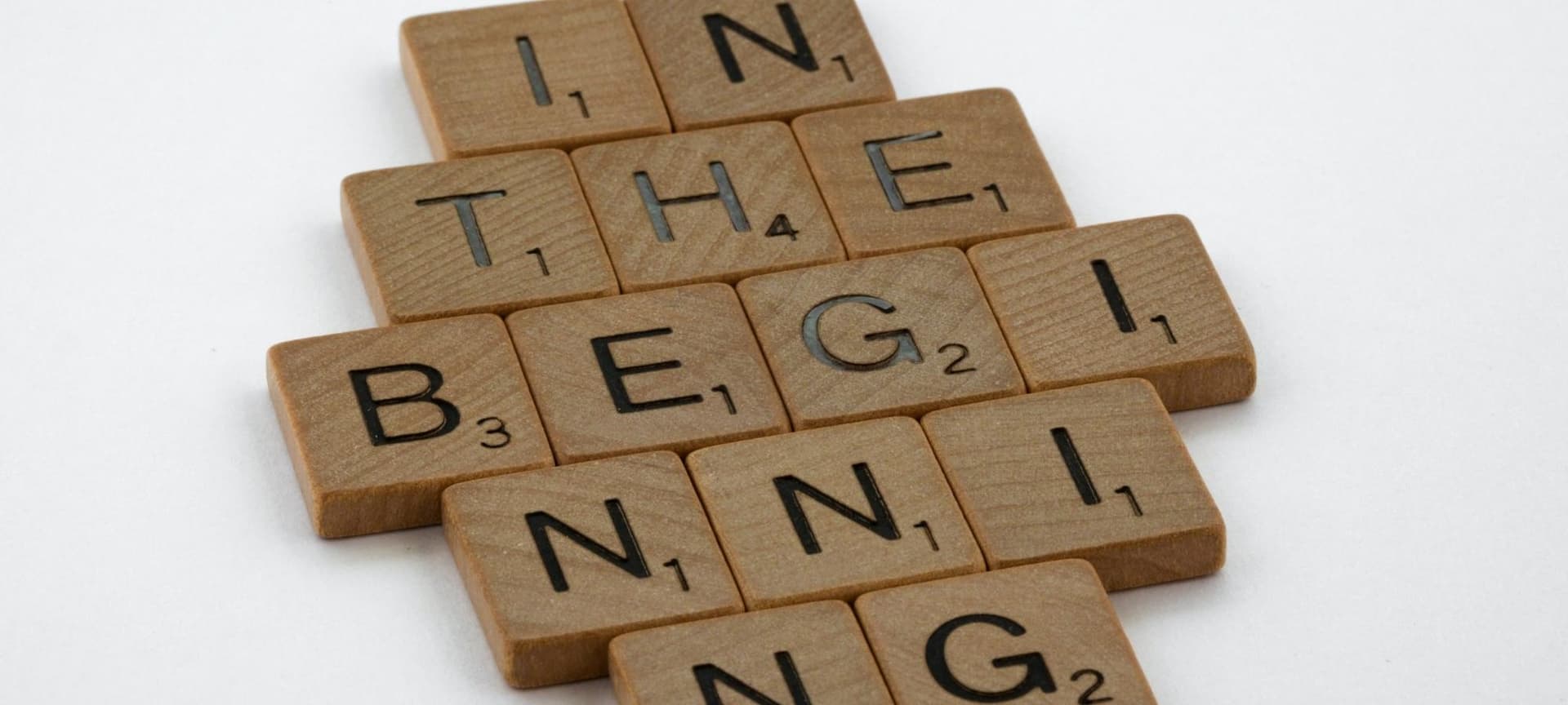 Scrabble tiles spelling out "In the beginning" from the book of Genesis