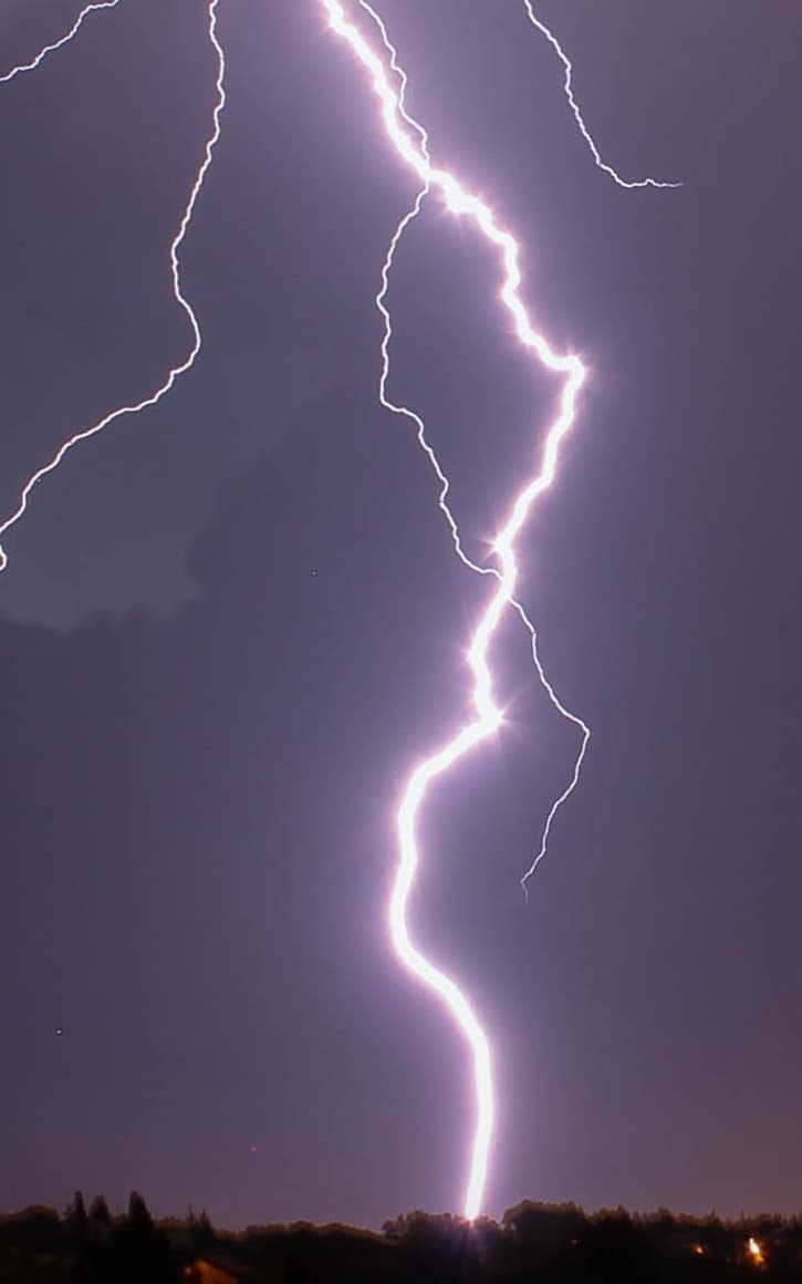 lightning against a purple sky