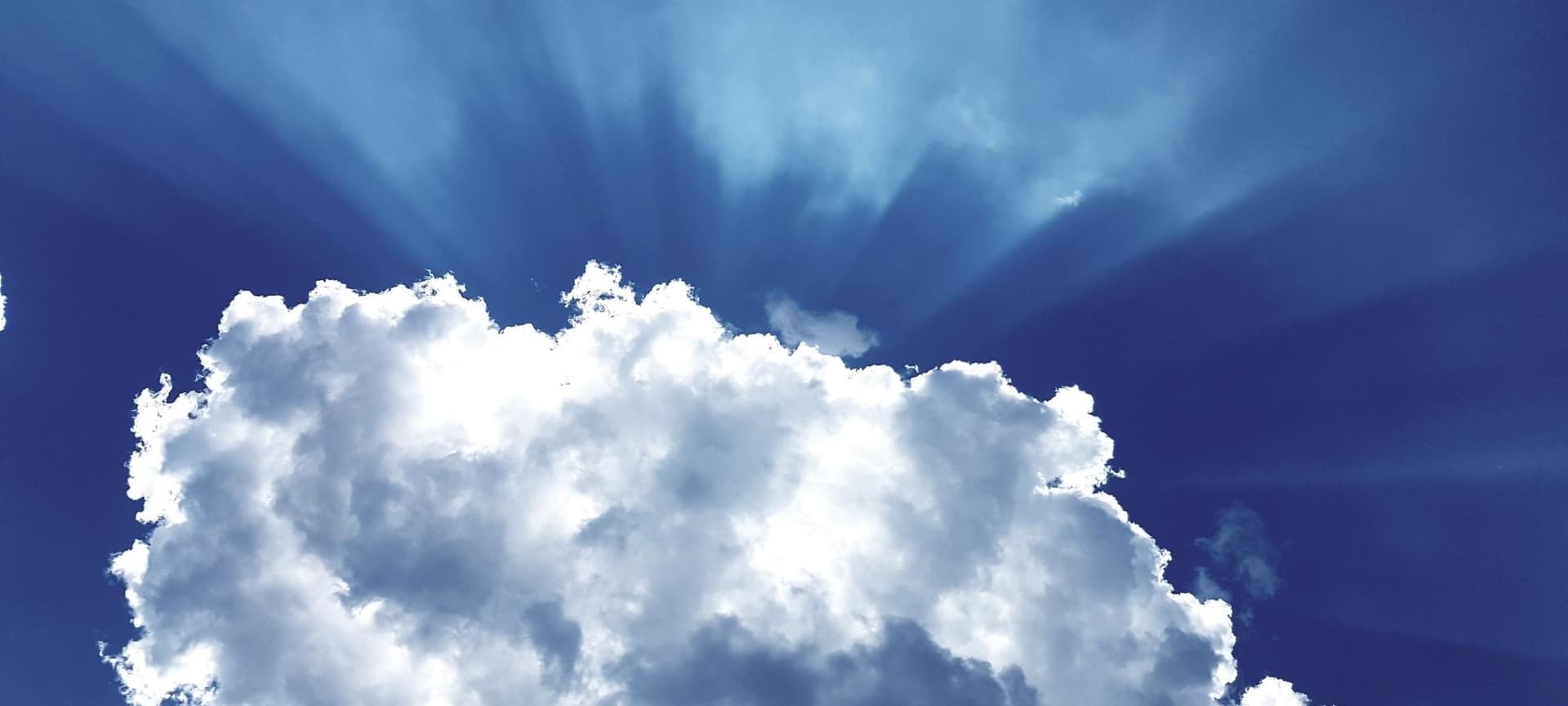 picturesque image of Blue sky with large cloud and light