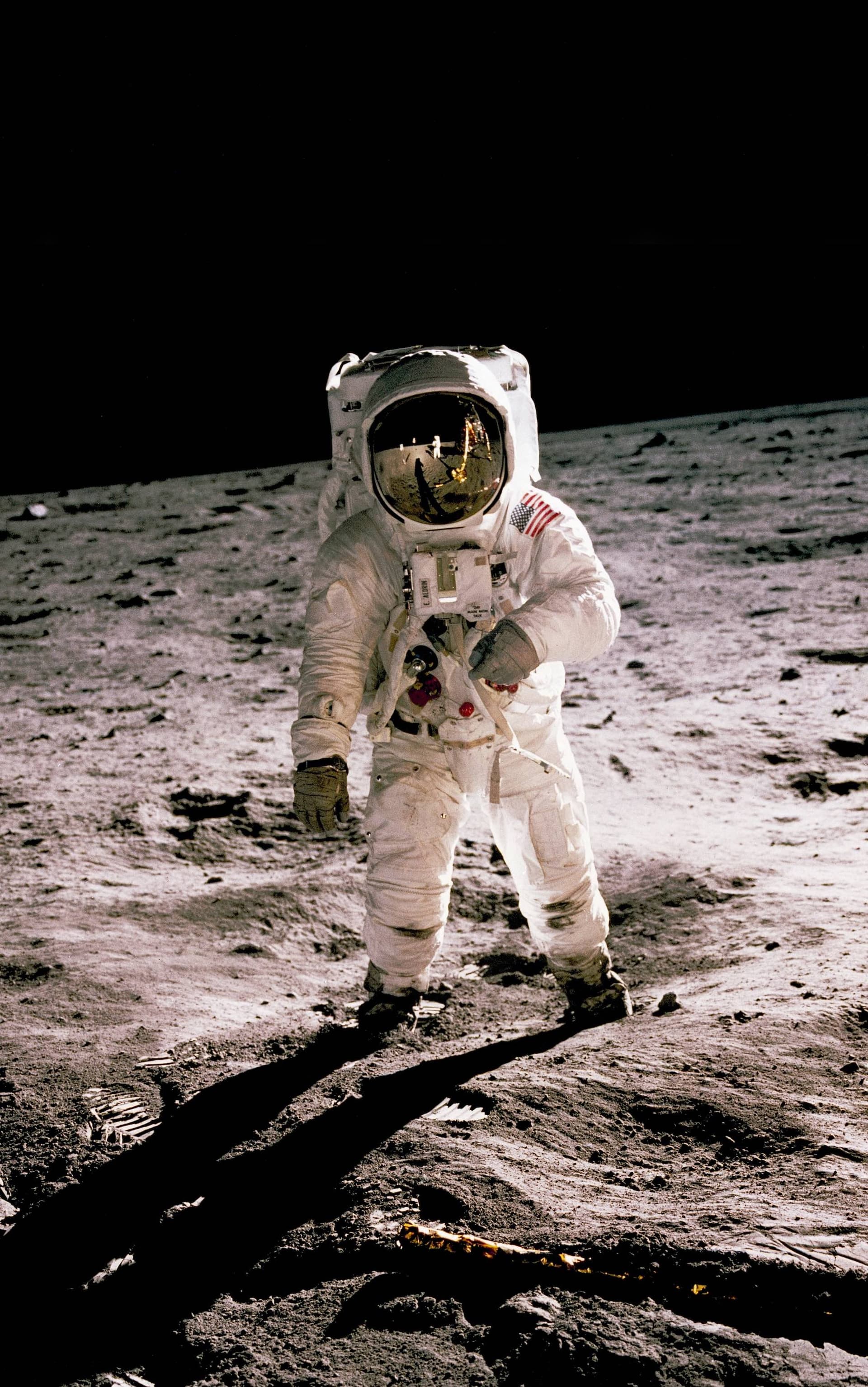 astronaut standing on the moon