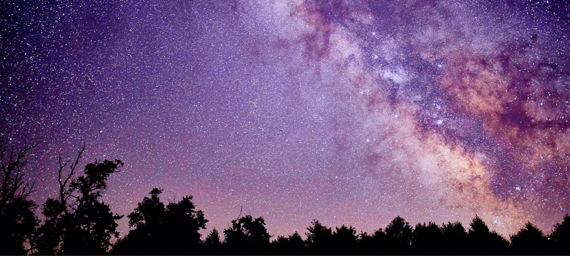 Night sky with stars with pink and purple tones