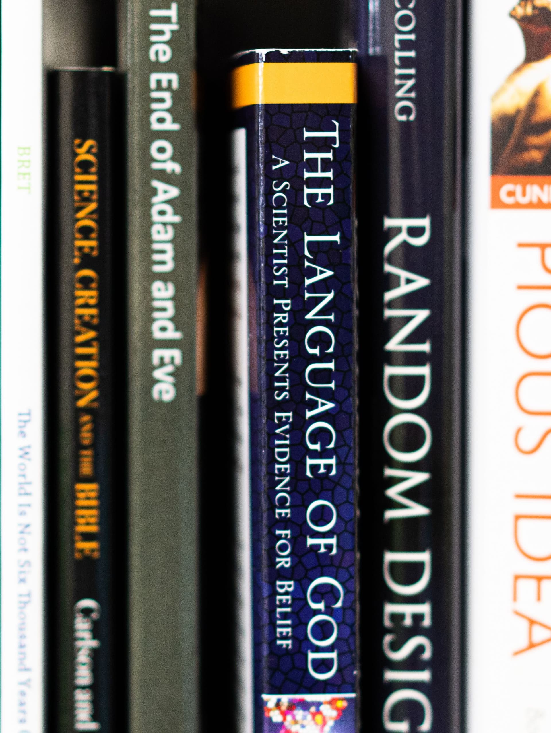 The Language of God boo on the shelf with other books