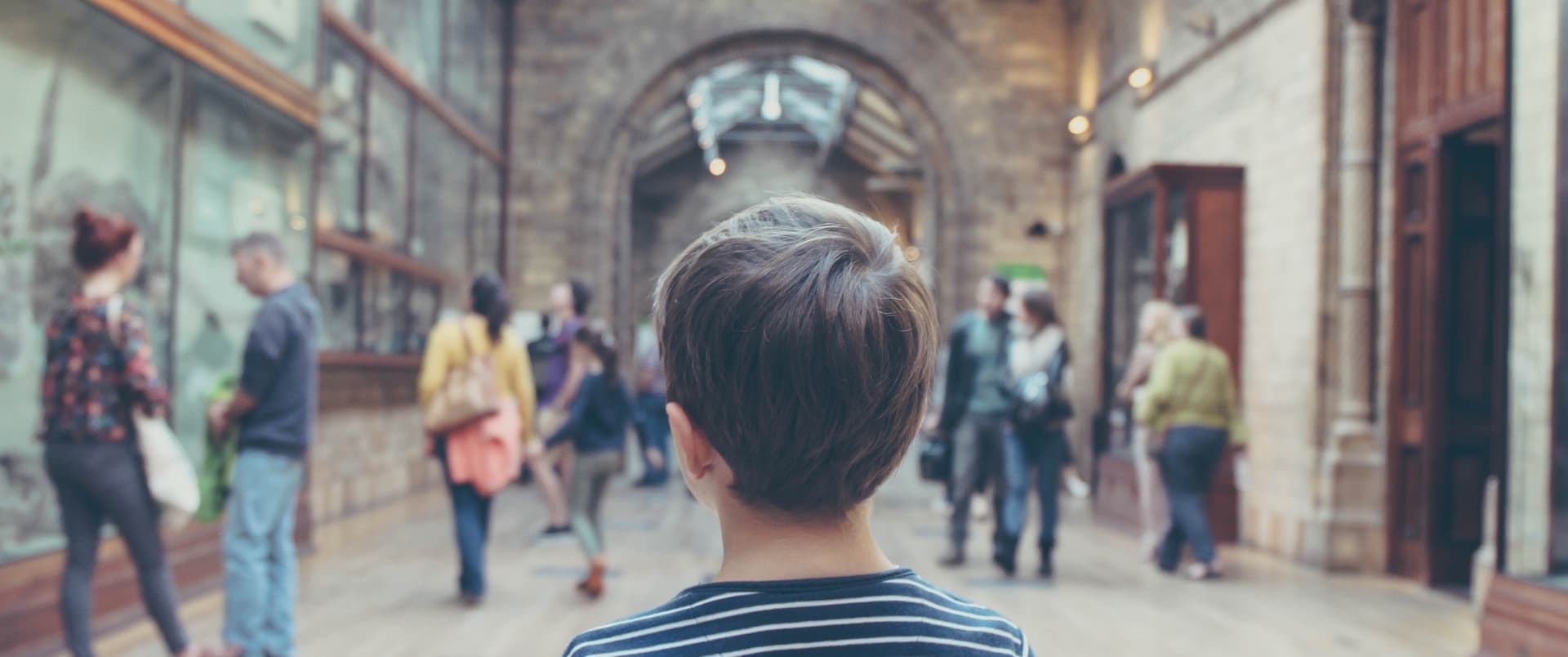 a child looking at a museum hall