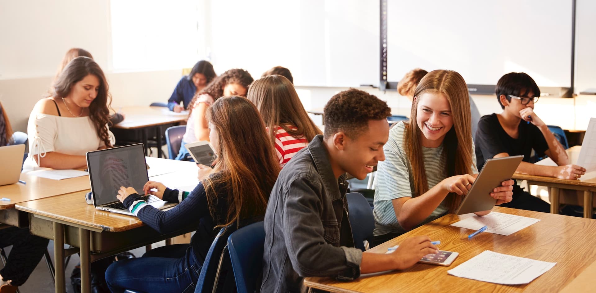 students in a classroom working on computers