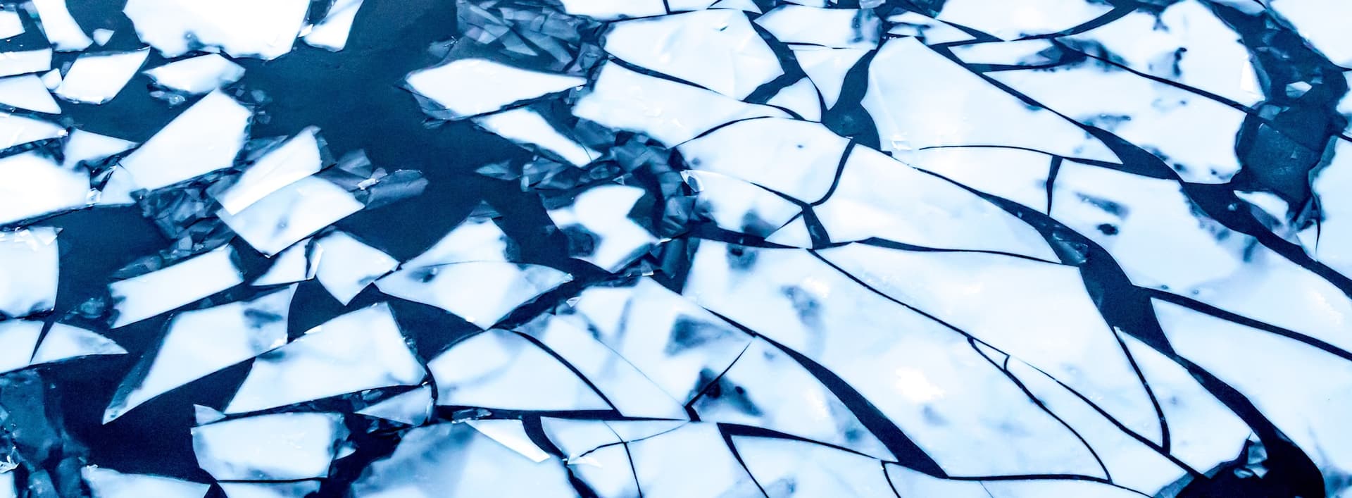 chunks of ice breaking into a body of water