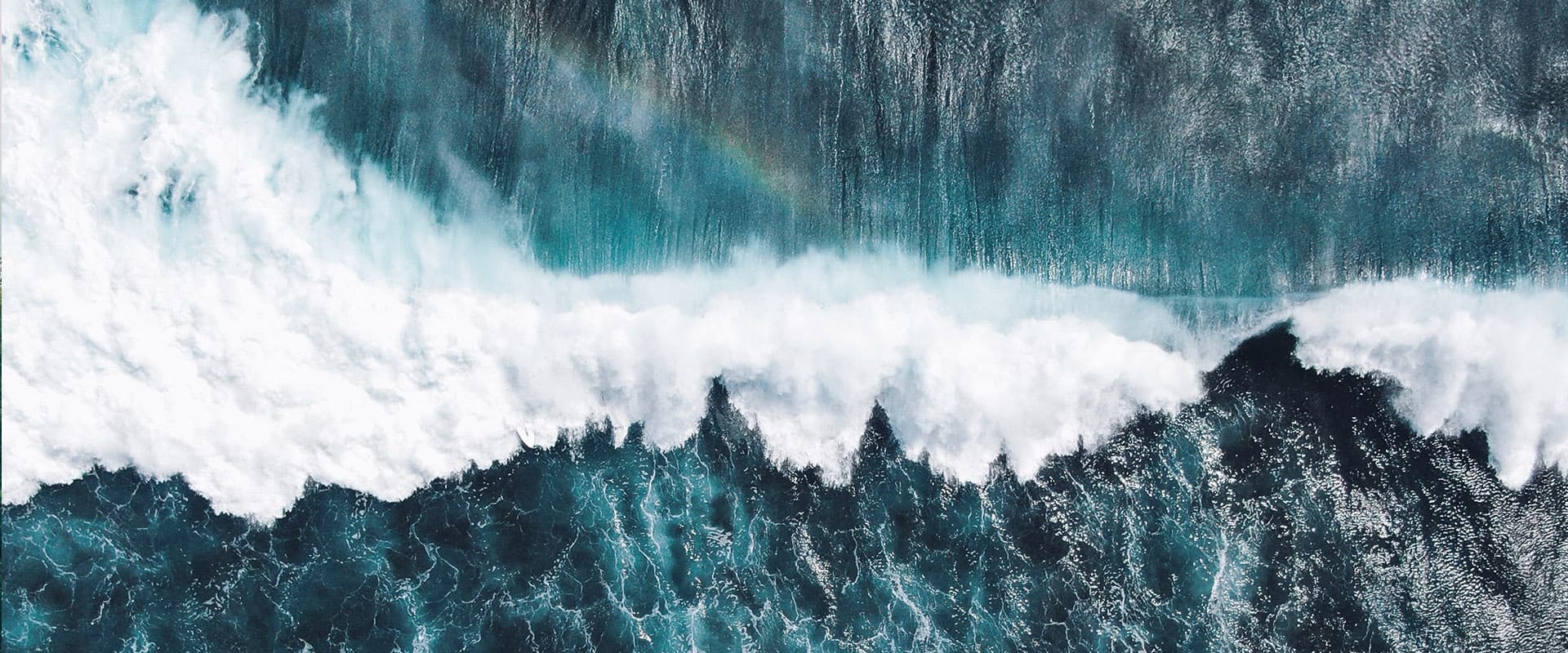 aerial view of breaking ocean wave