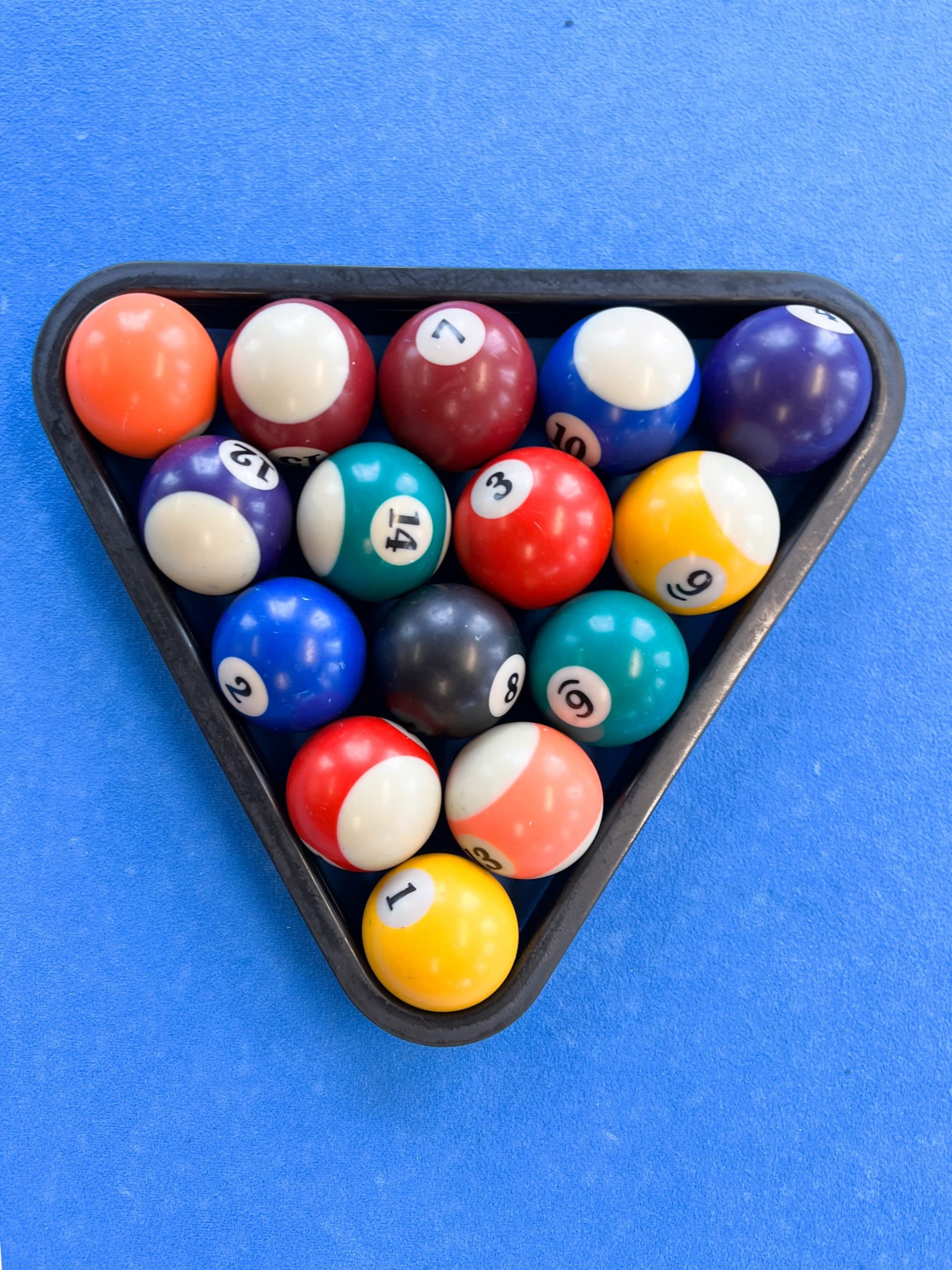 Pool balls on blue pool table