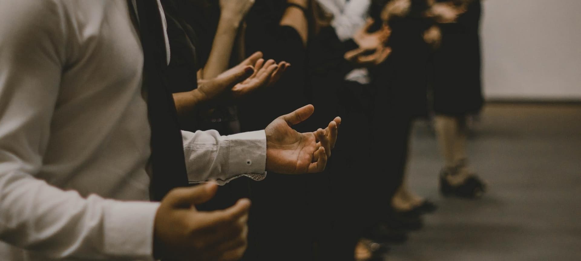 church congregation with raised and open hands