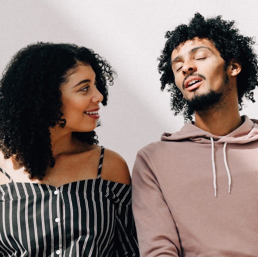 couple sitting on a bench talking