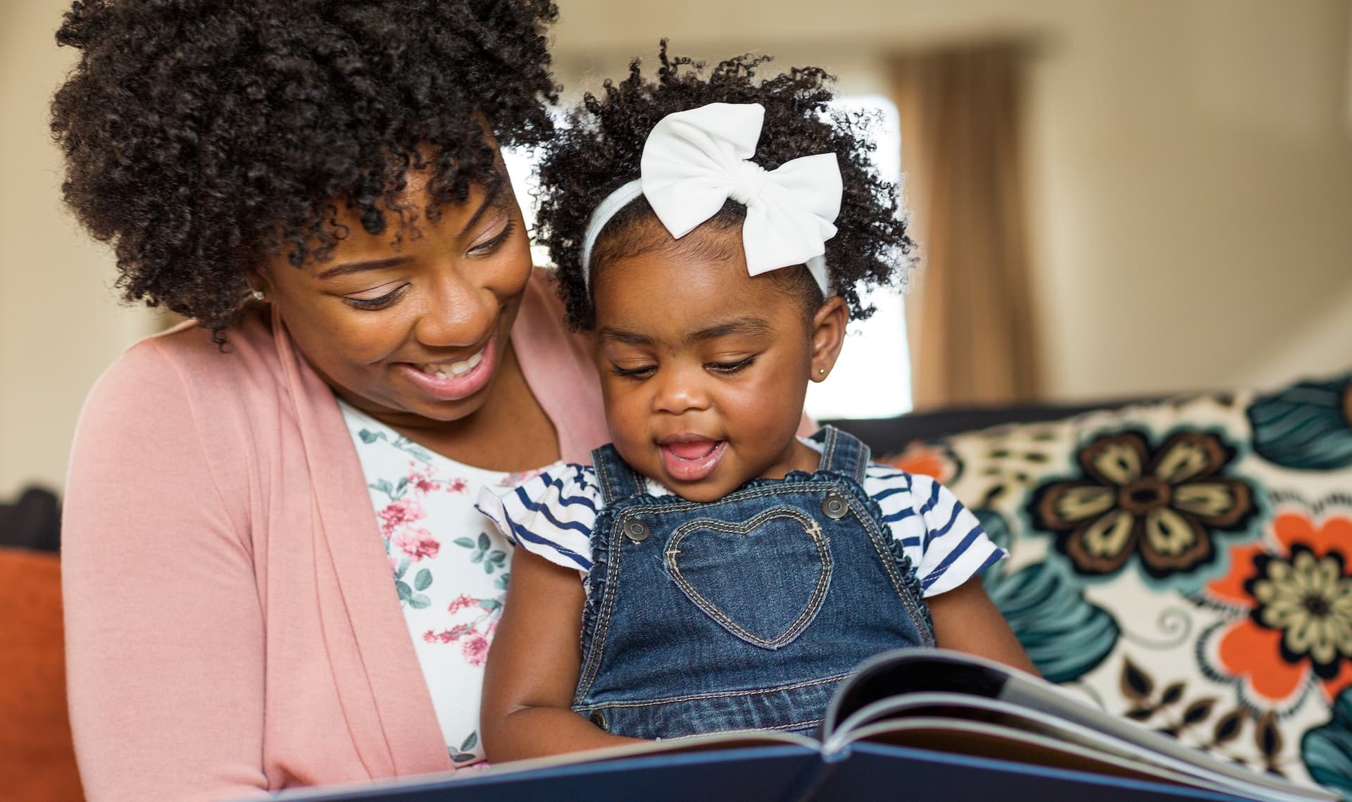 mom reading to a baby