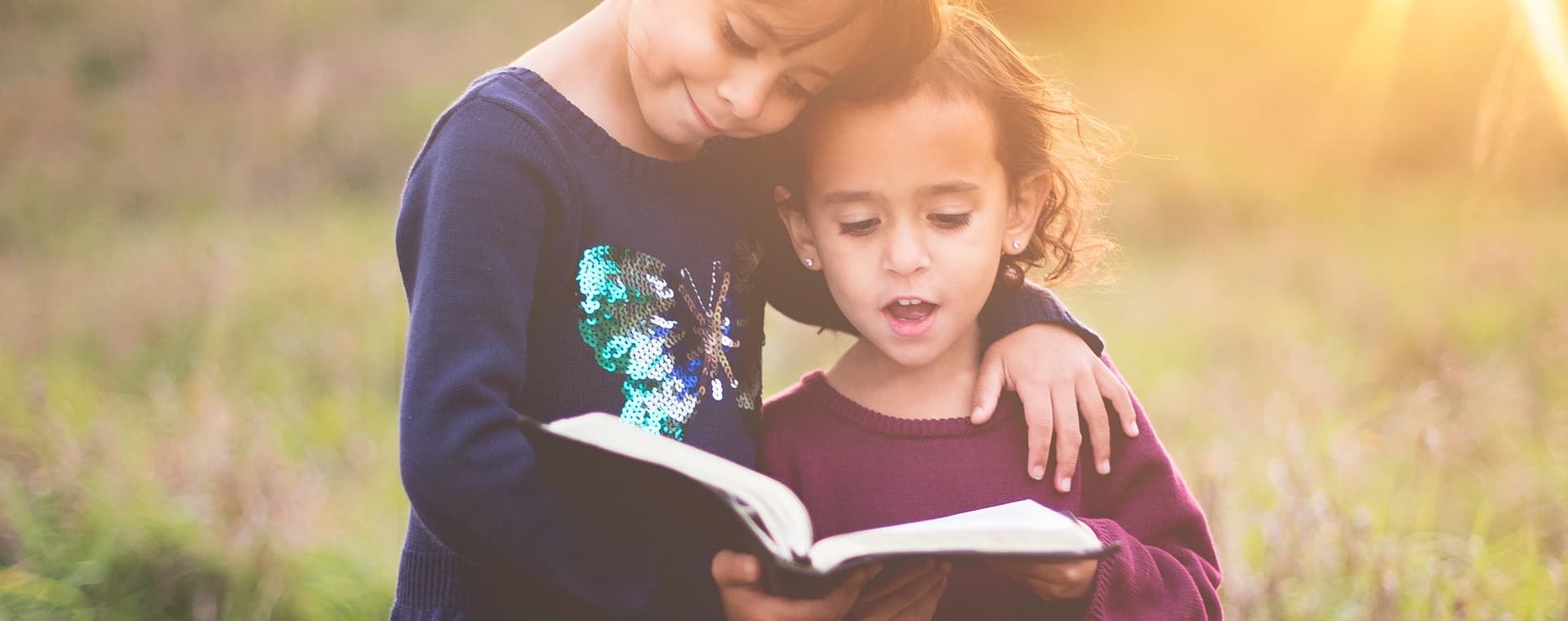girls reading bible