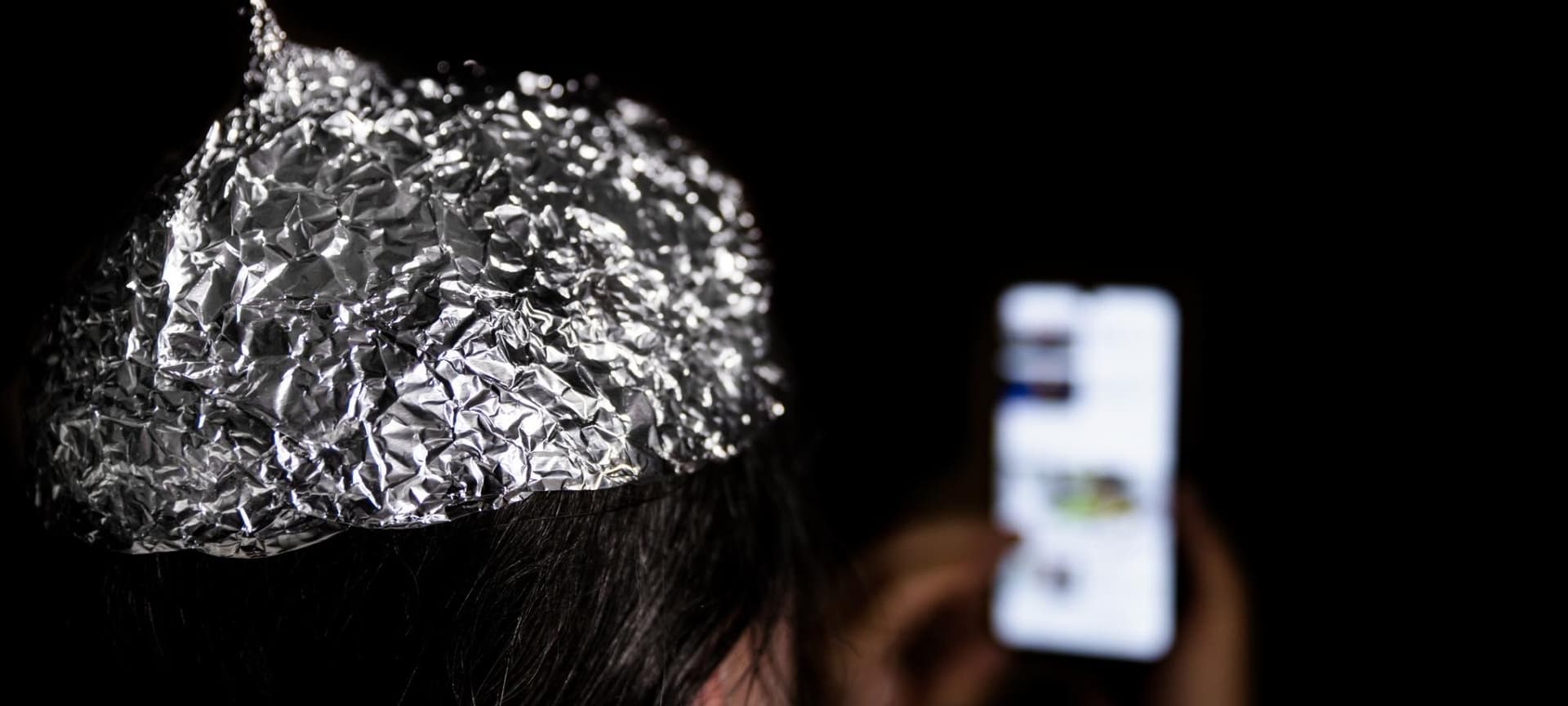 Person wearing tin foil hat