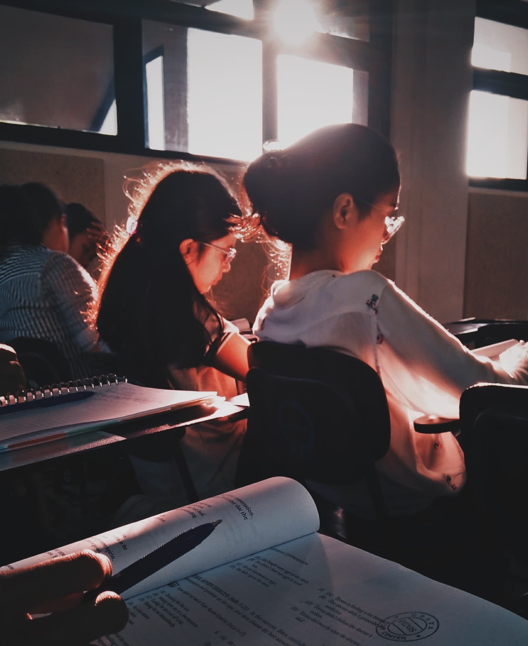 two women sitting in a classroom