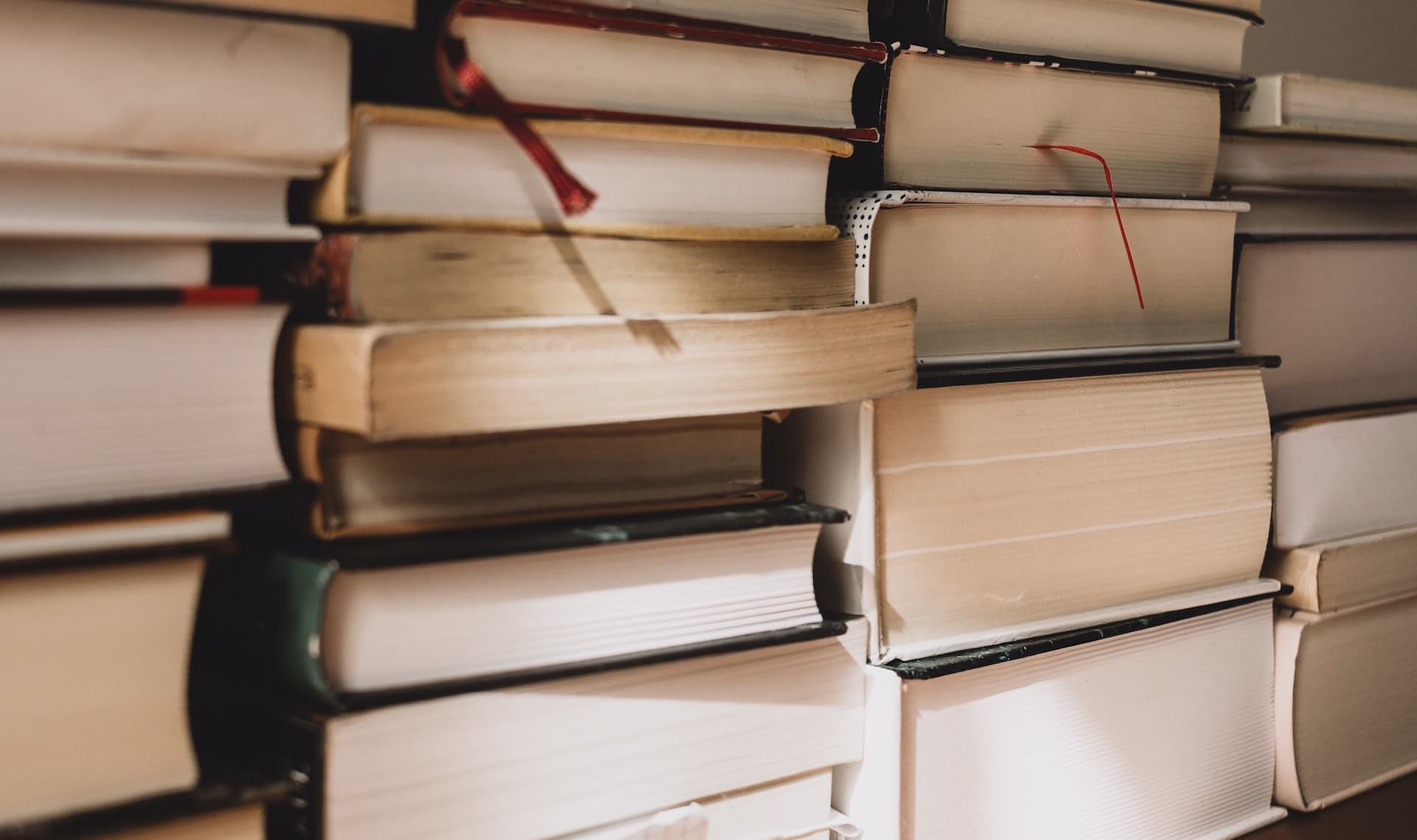 stacks of hardbound textbooks