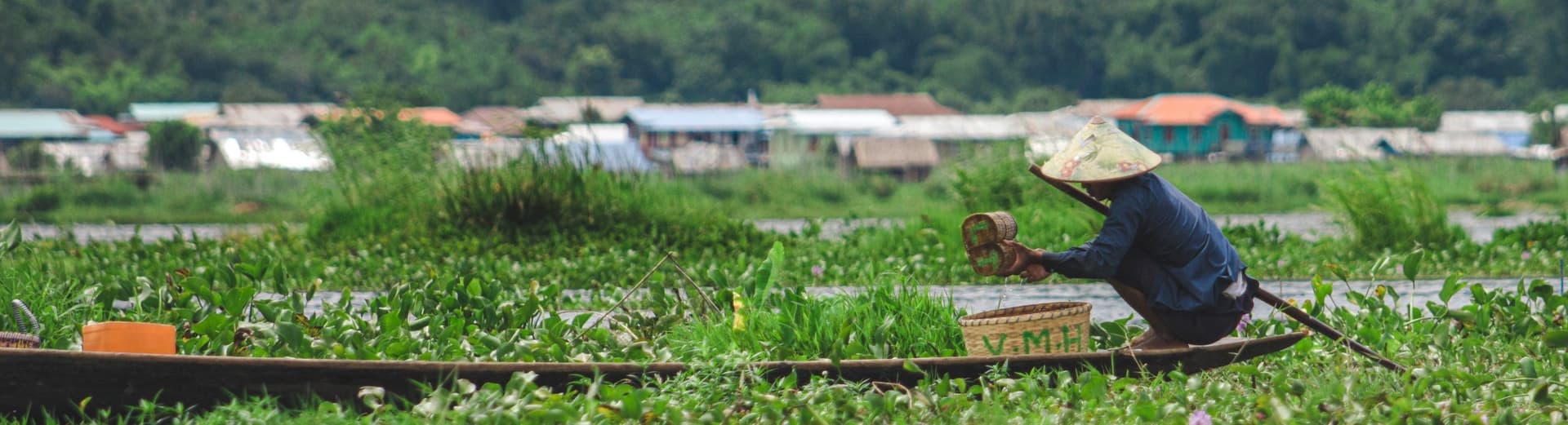 farmer in myanmar in a boat
