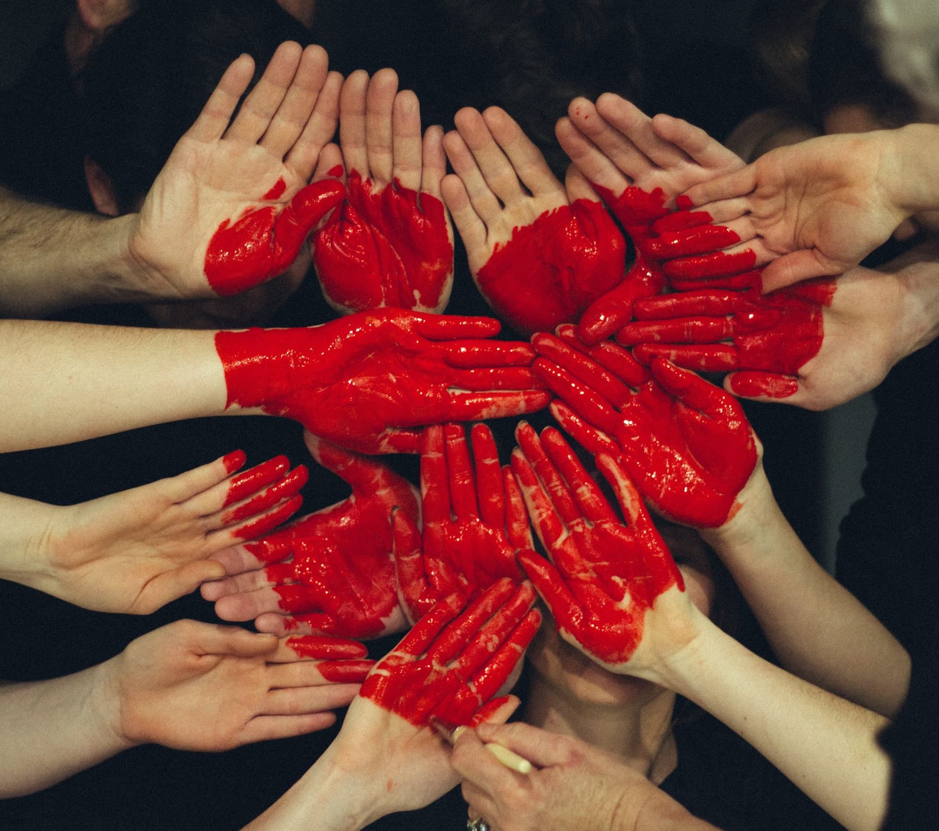 Hands painted with a red heart