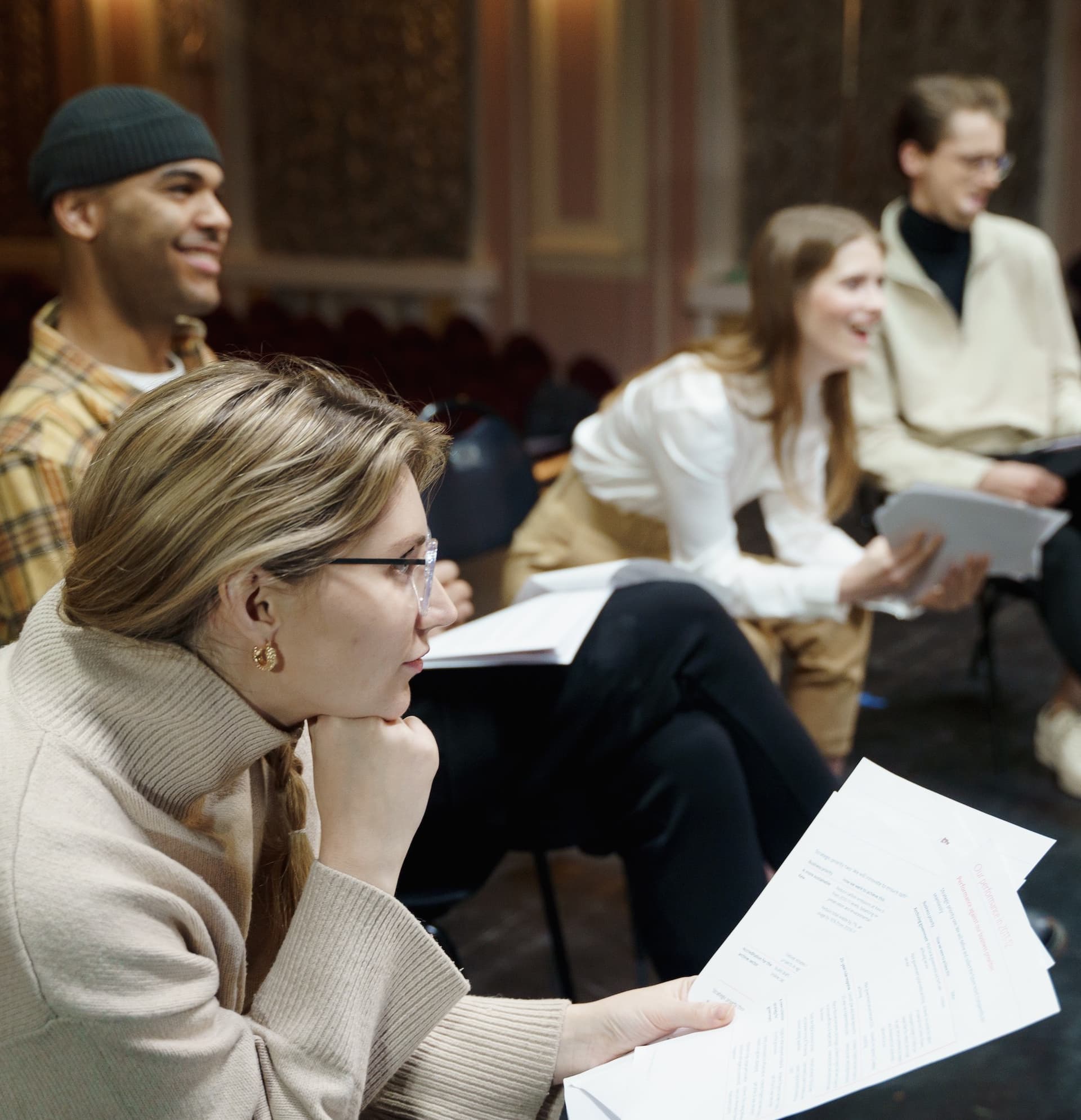 actors sitting with scripts in their lap