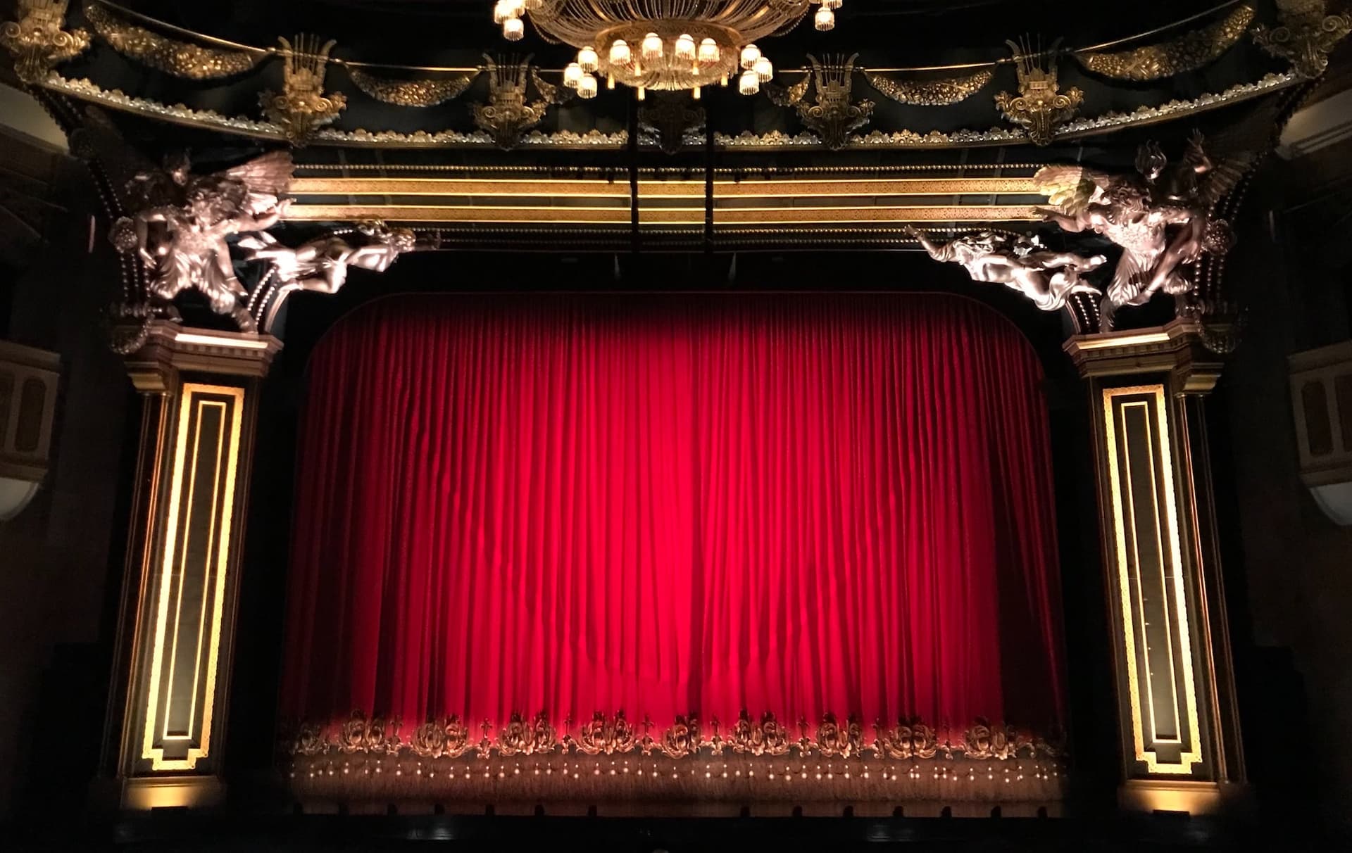 a theatre stage with a red curtain