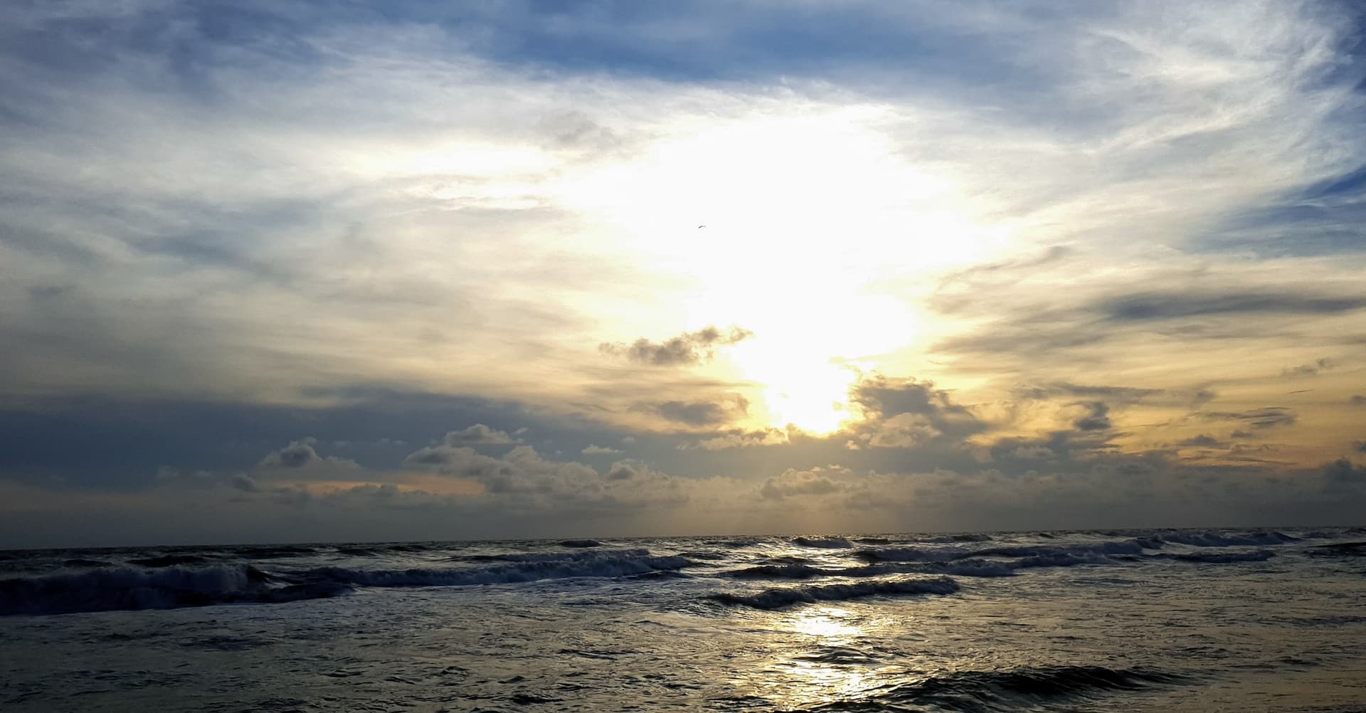 sun over a body of water