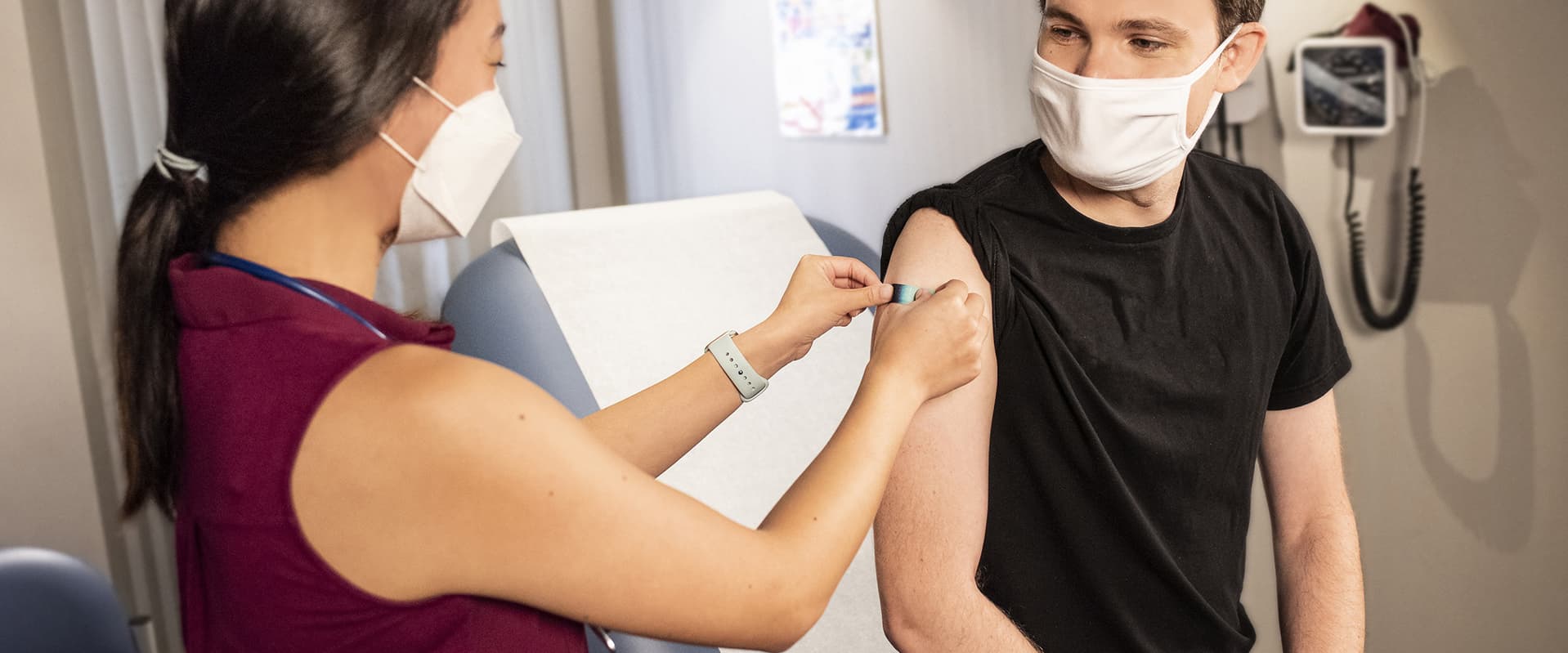 young person getting bandaid after vaccine