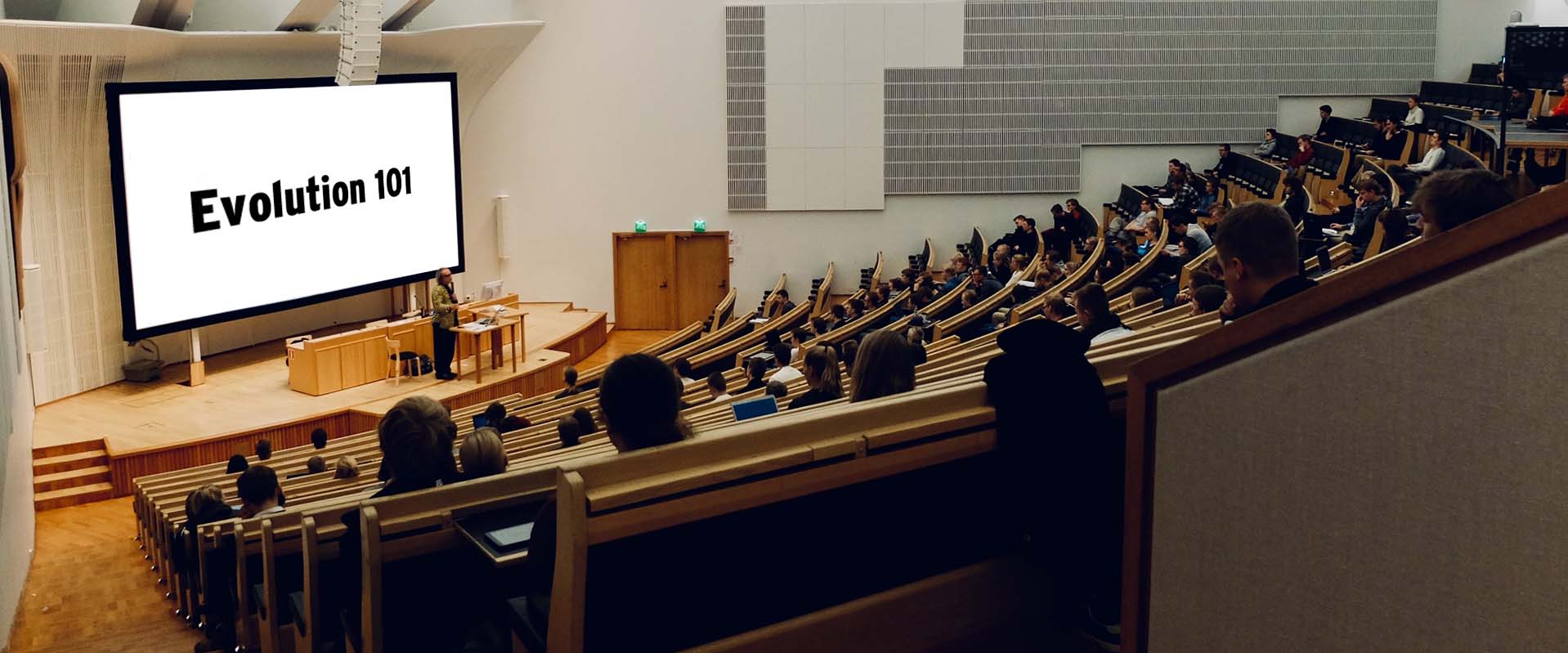 Classroom with evolution 101 on screen
