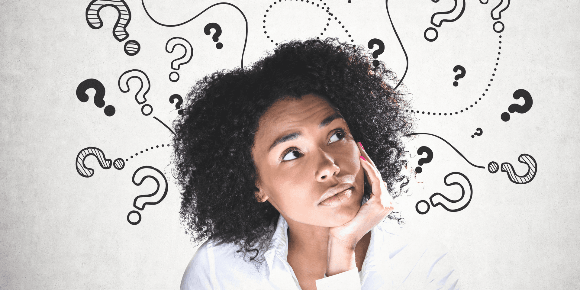 Black woman thinking with drawn question marks around her head