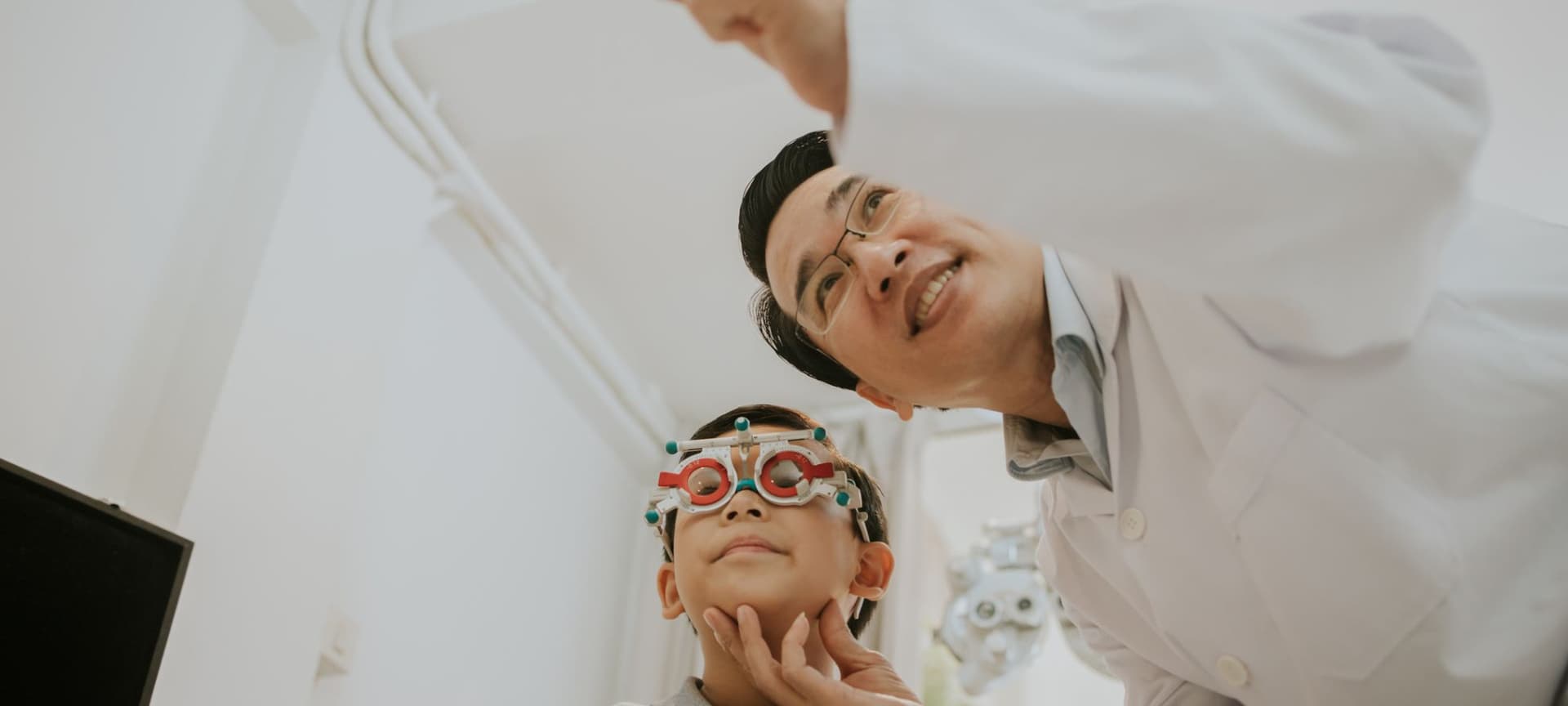 opthalmologist helping kid patient