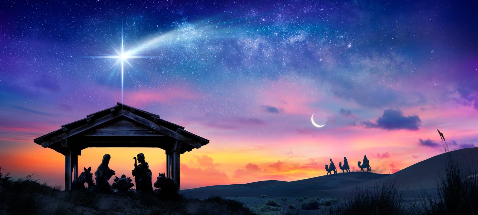 nativity under a colorful night sky of stars