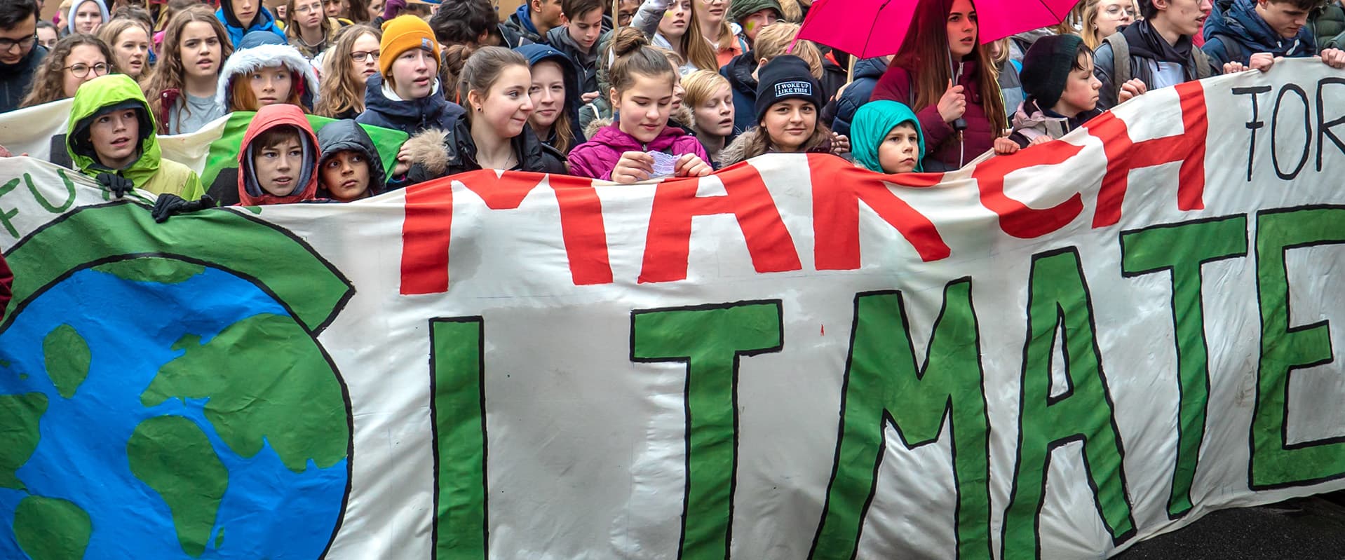 kids holding sign at climate march