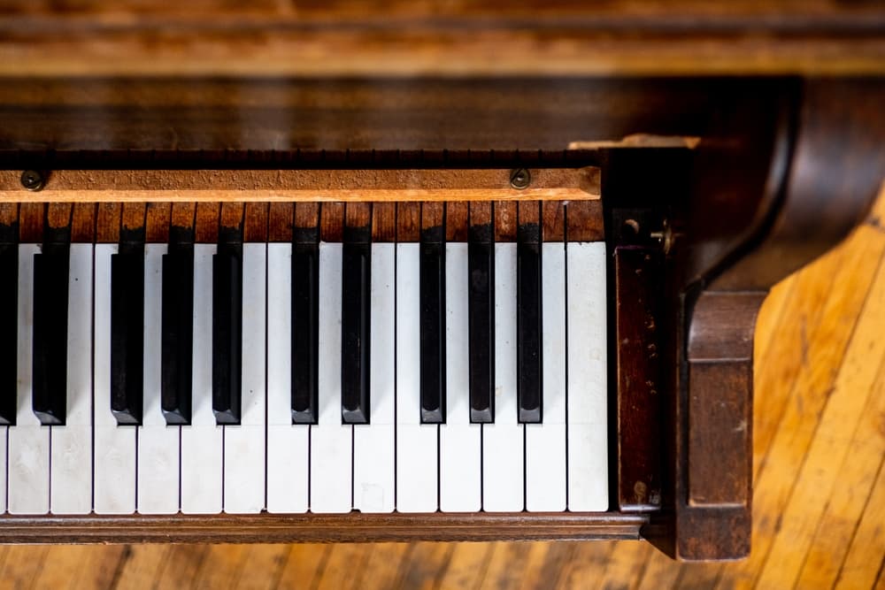 Closeup of an antique piano, black and white keys