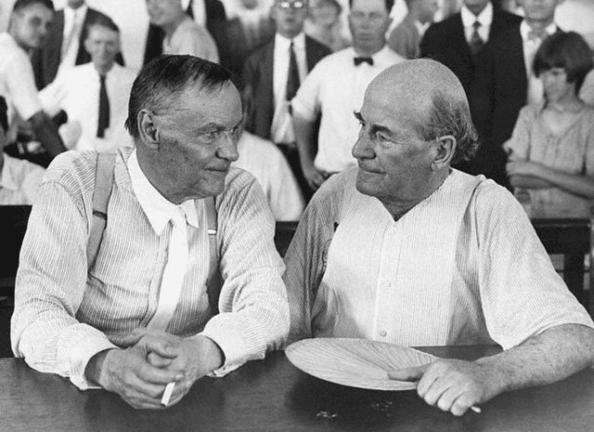 Photo of Clarence Darrow and William Jennings Bryan sitting together during the Scopes Trial, 1925.
