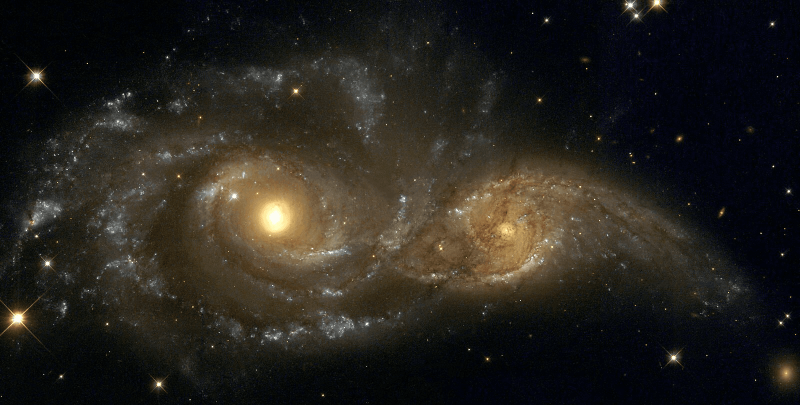 An image from the Hubble Space Telescope, depicting two near colliding spiral galaxies about 80 million light years away.