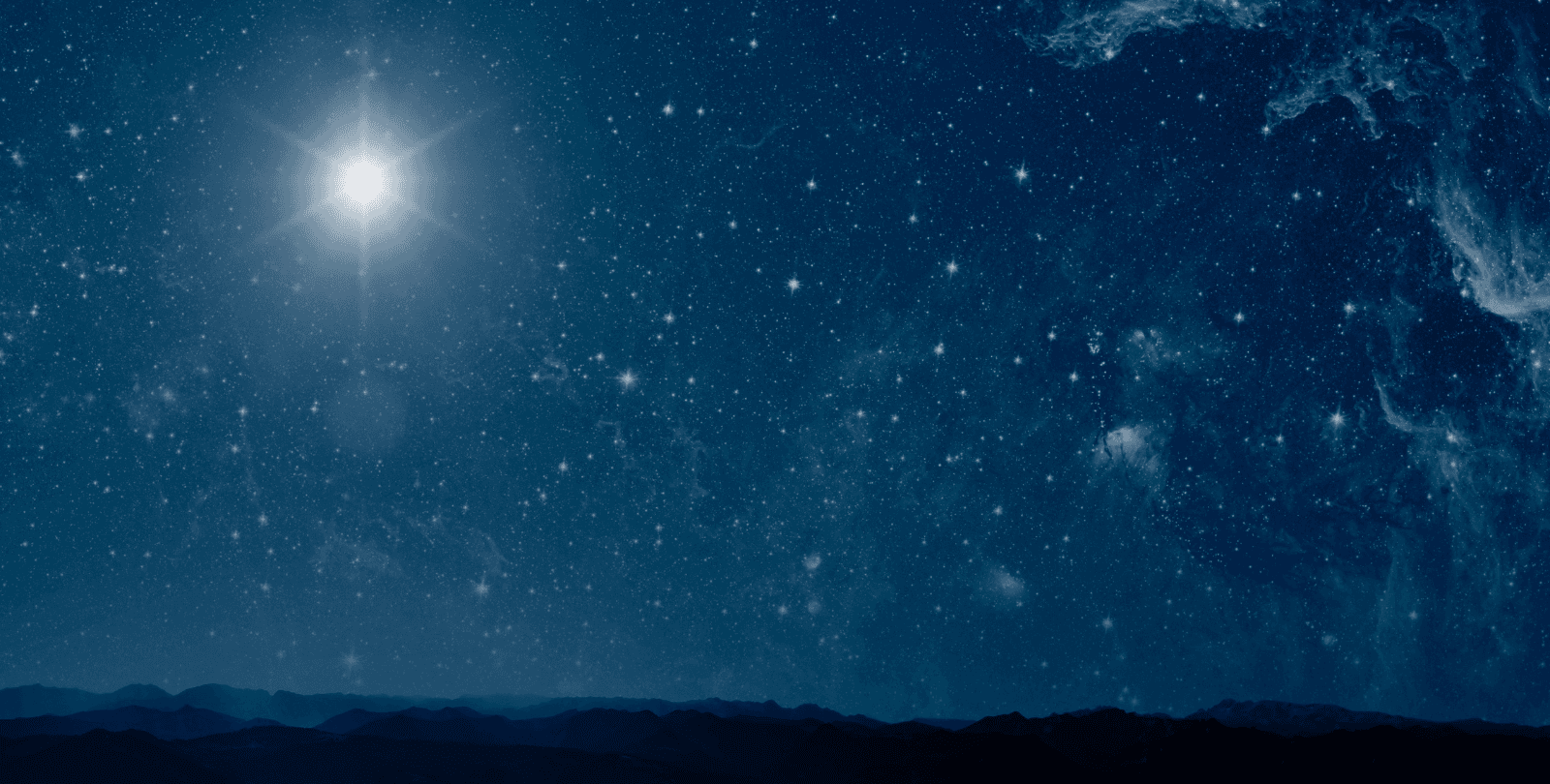 The Star of Bethlehem shines in a star-filled sky over shadowy hills.