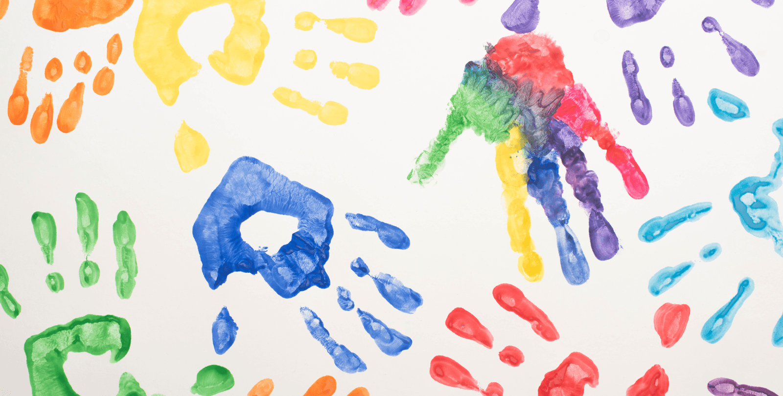 Photo of paint handprints in all different colors.