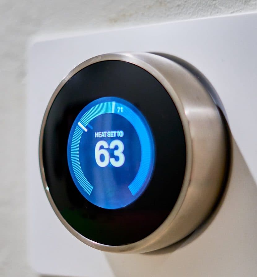 programmable thermostat set to 63 degrees