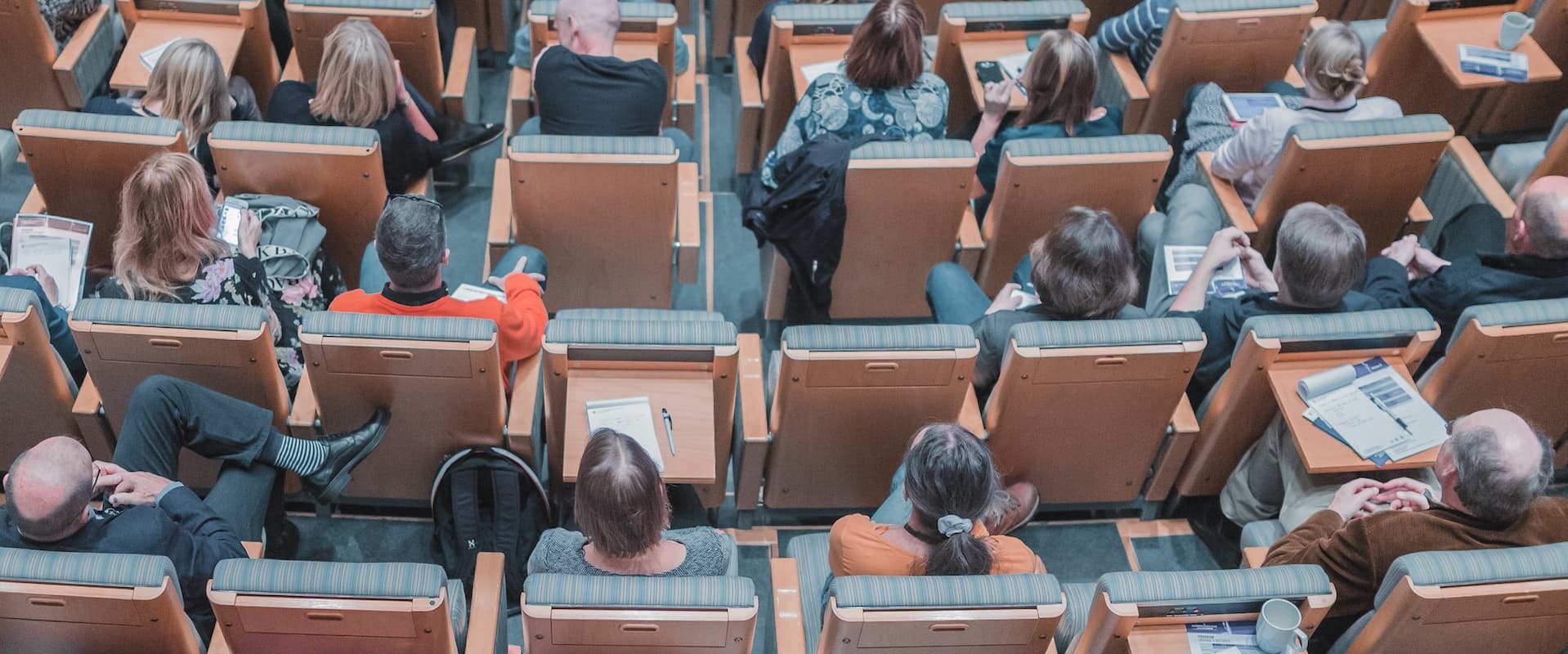 students in rows in classroom auditorium