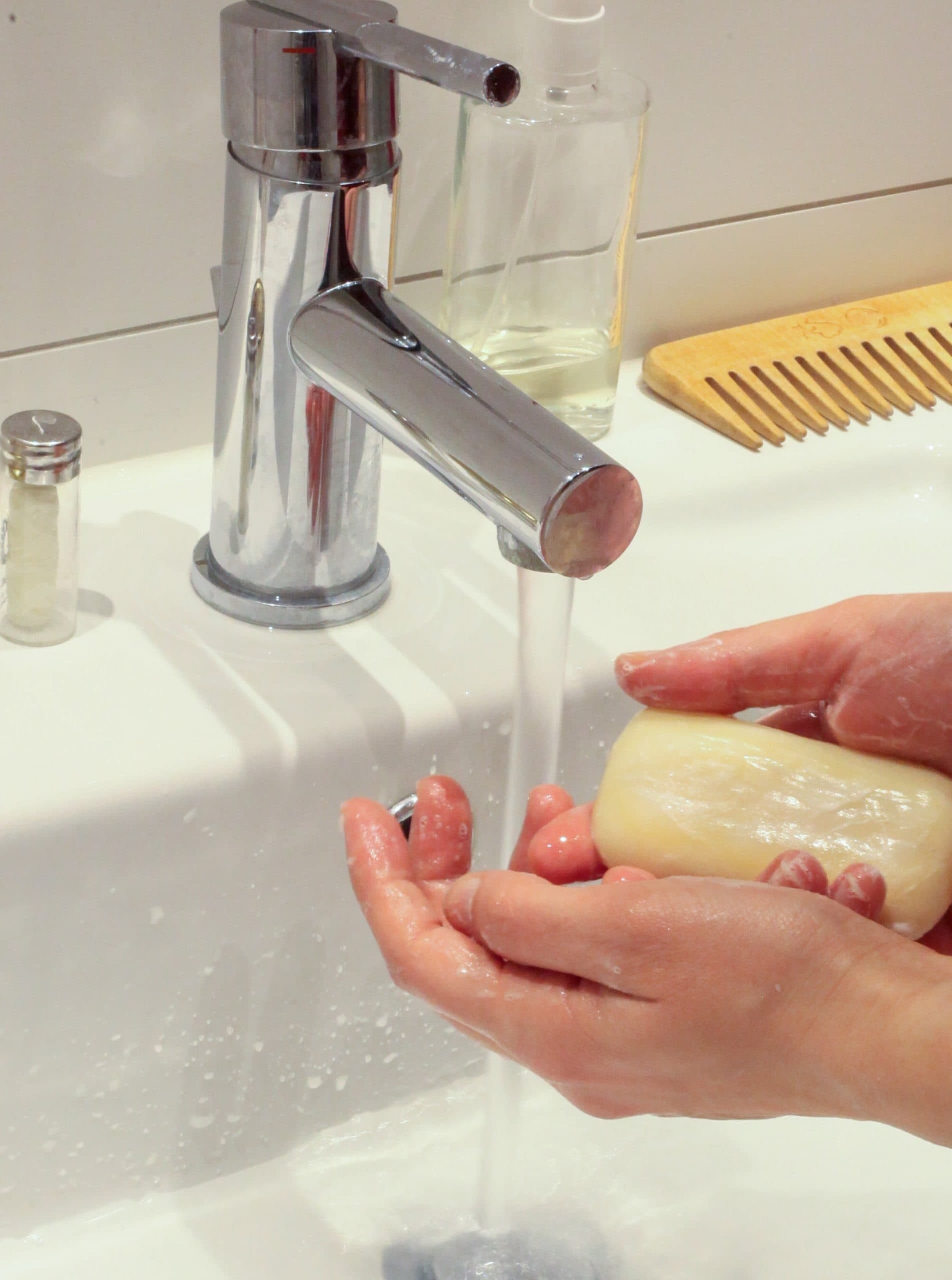 hands washing with bar of soap