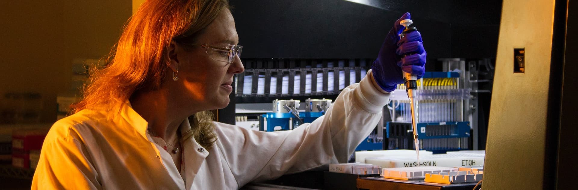 woman pipetting in a lab