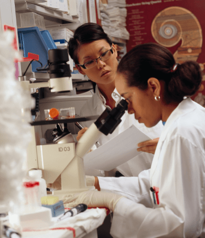 Women conducting research at a lab bench