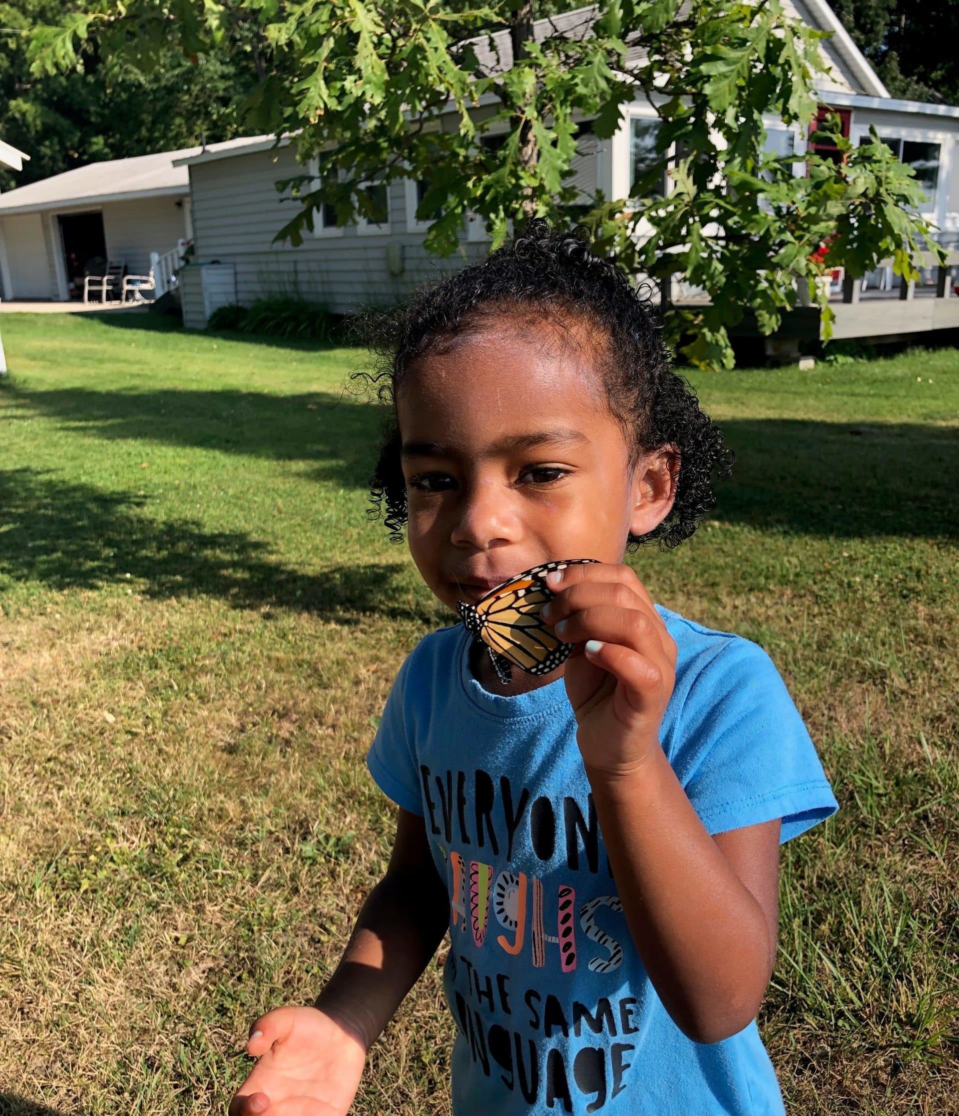 Grand daughter holding a butterfly