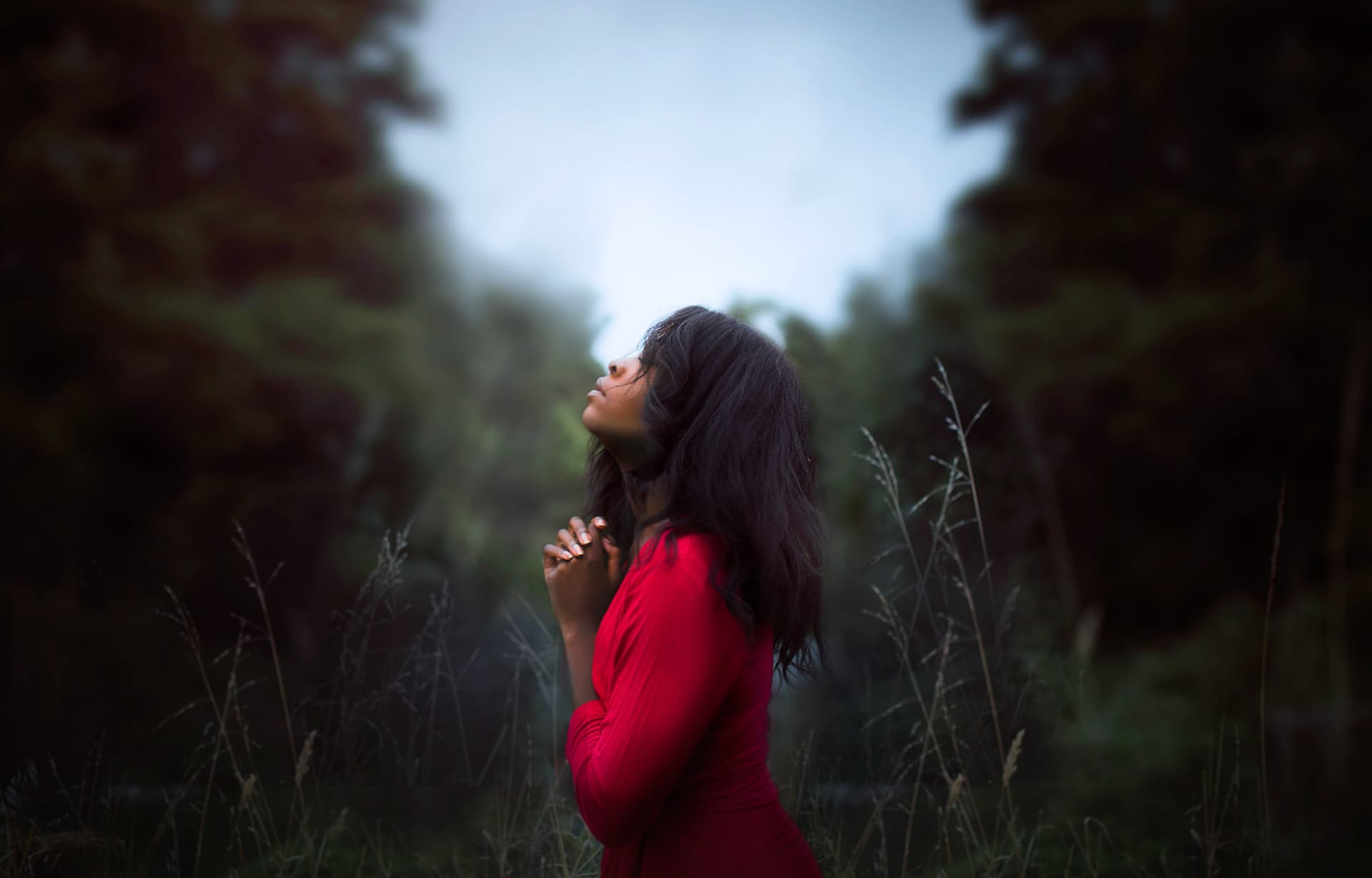 Woman praying in nature