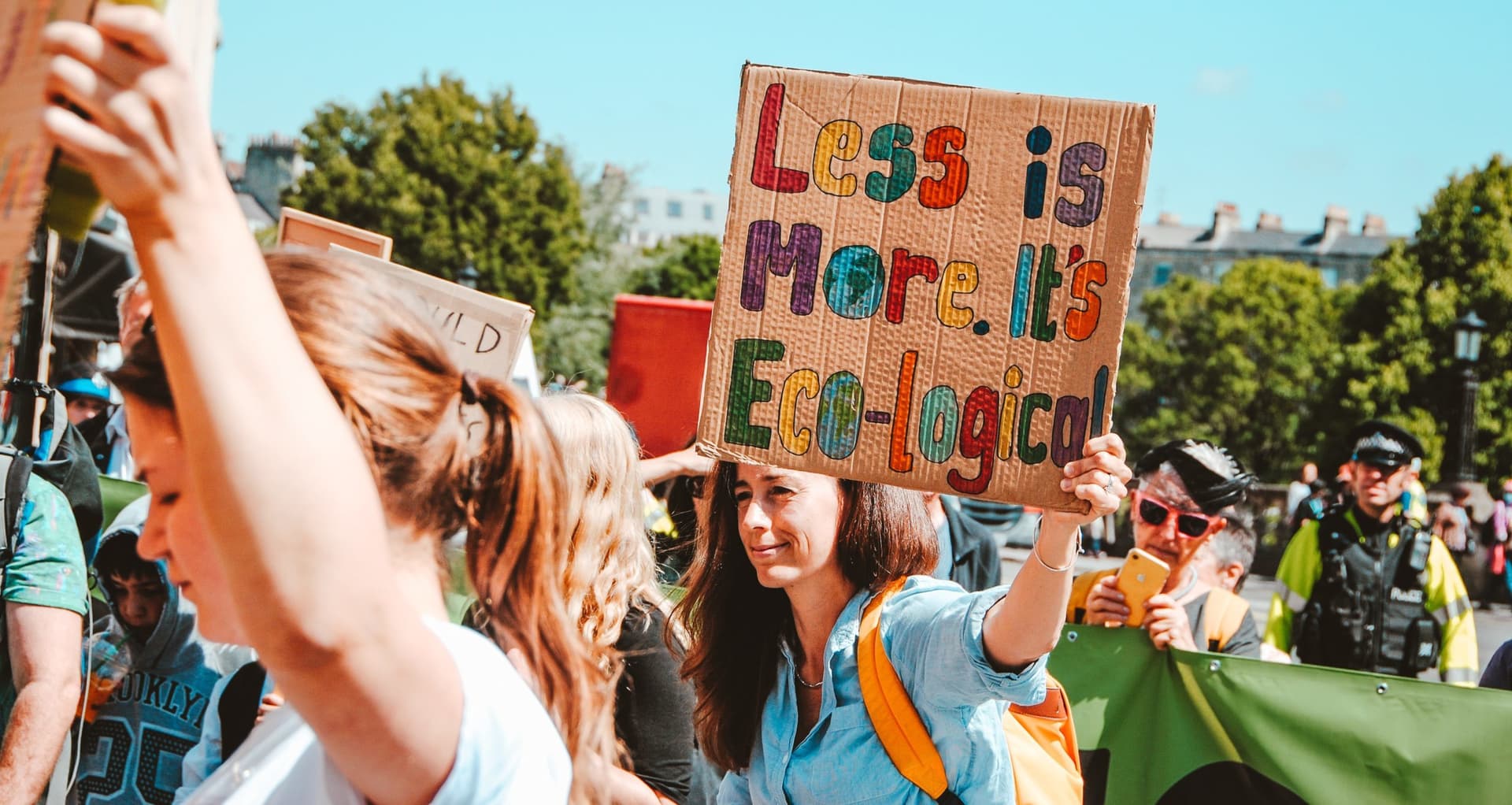 People carrying environmental activism signs