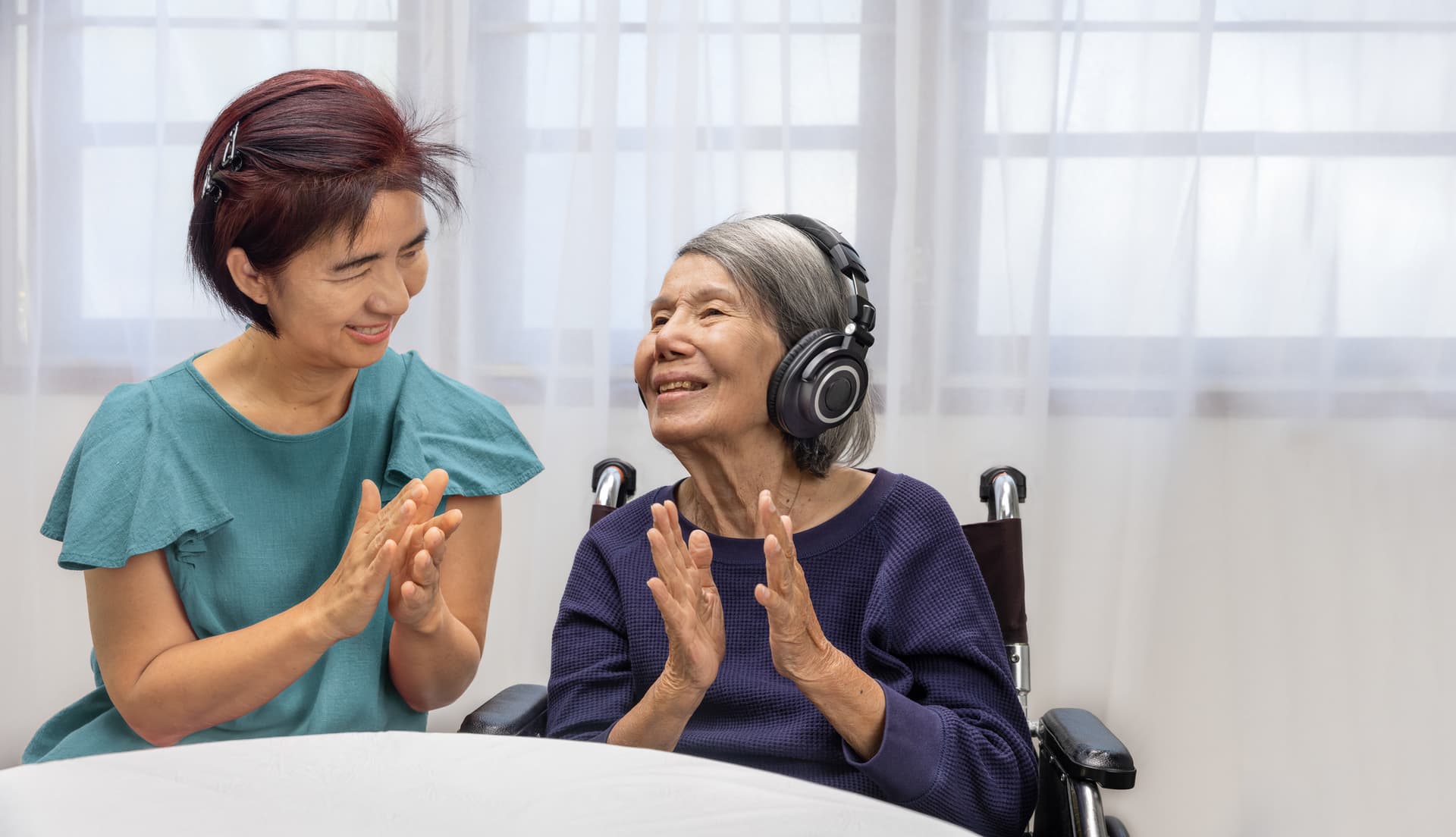 An elderly patient with dementia engaging in music therapy.